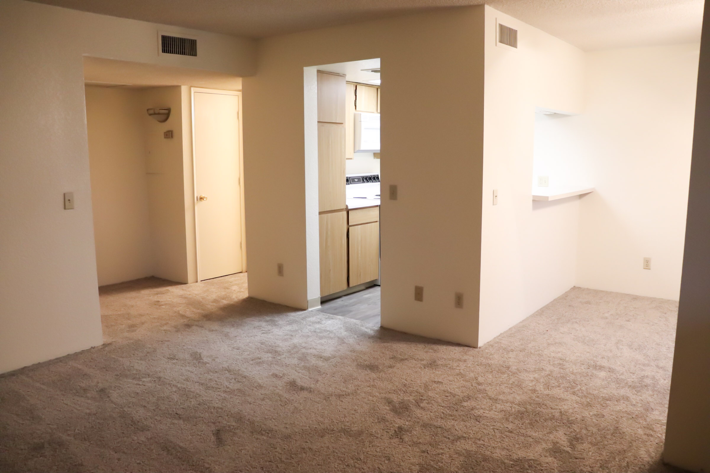 a white refrigerator freezer sitting inside of a building