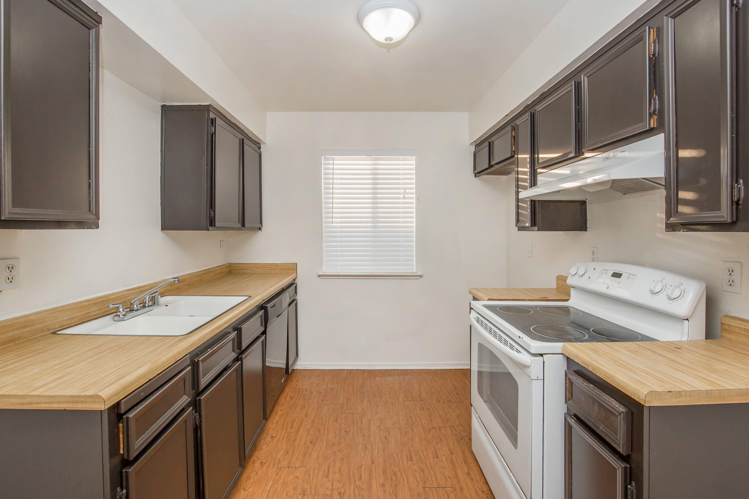 a kitchen with a sink and a microwave