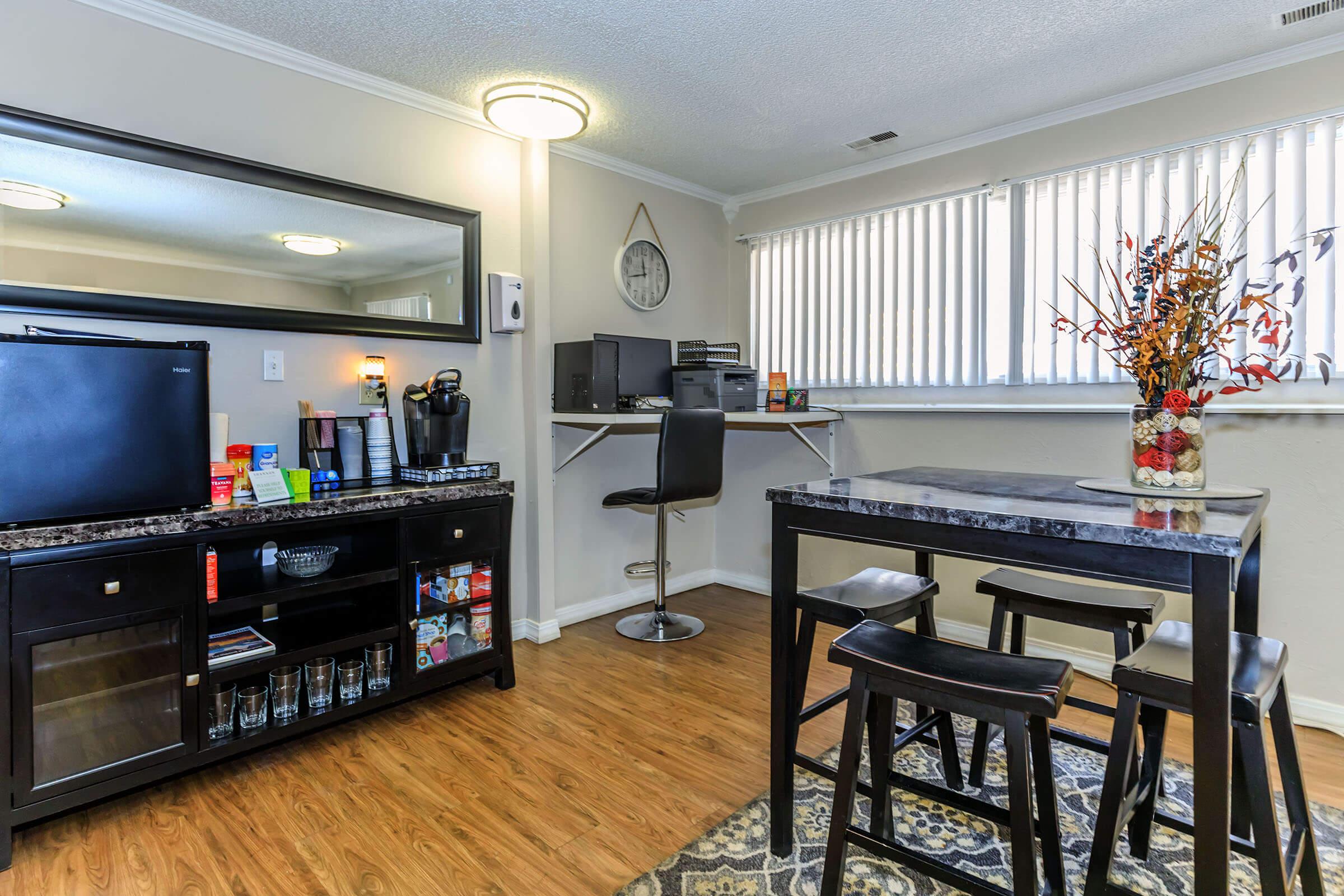 a living room filled with furniture and a flat screen tv