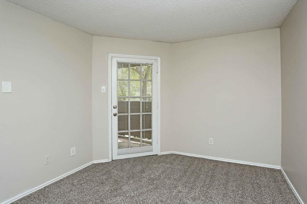 a bedroom with a large window