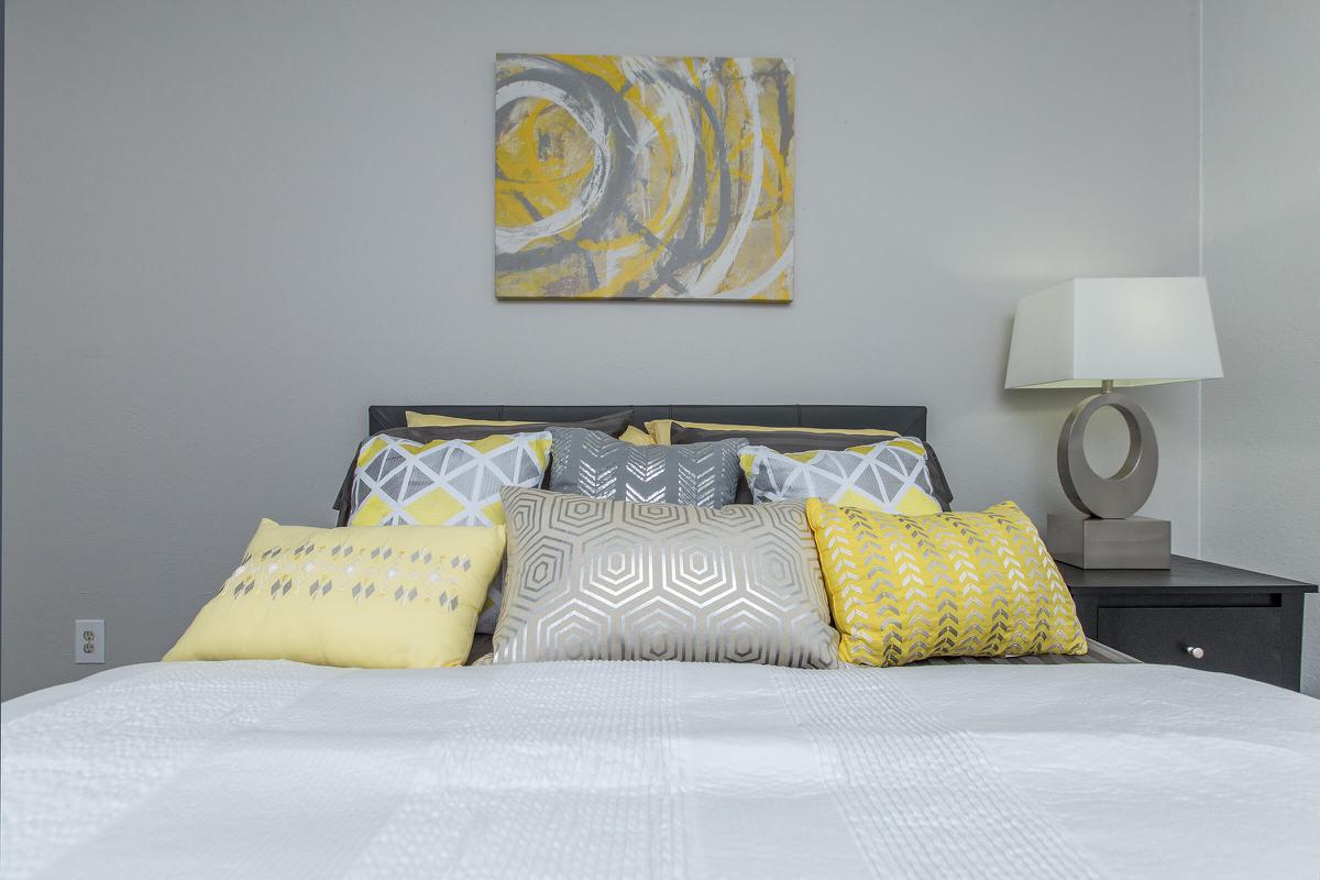 a yellow bed in a room