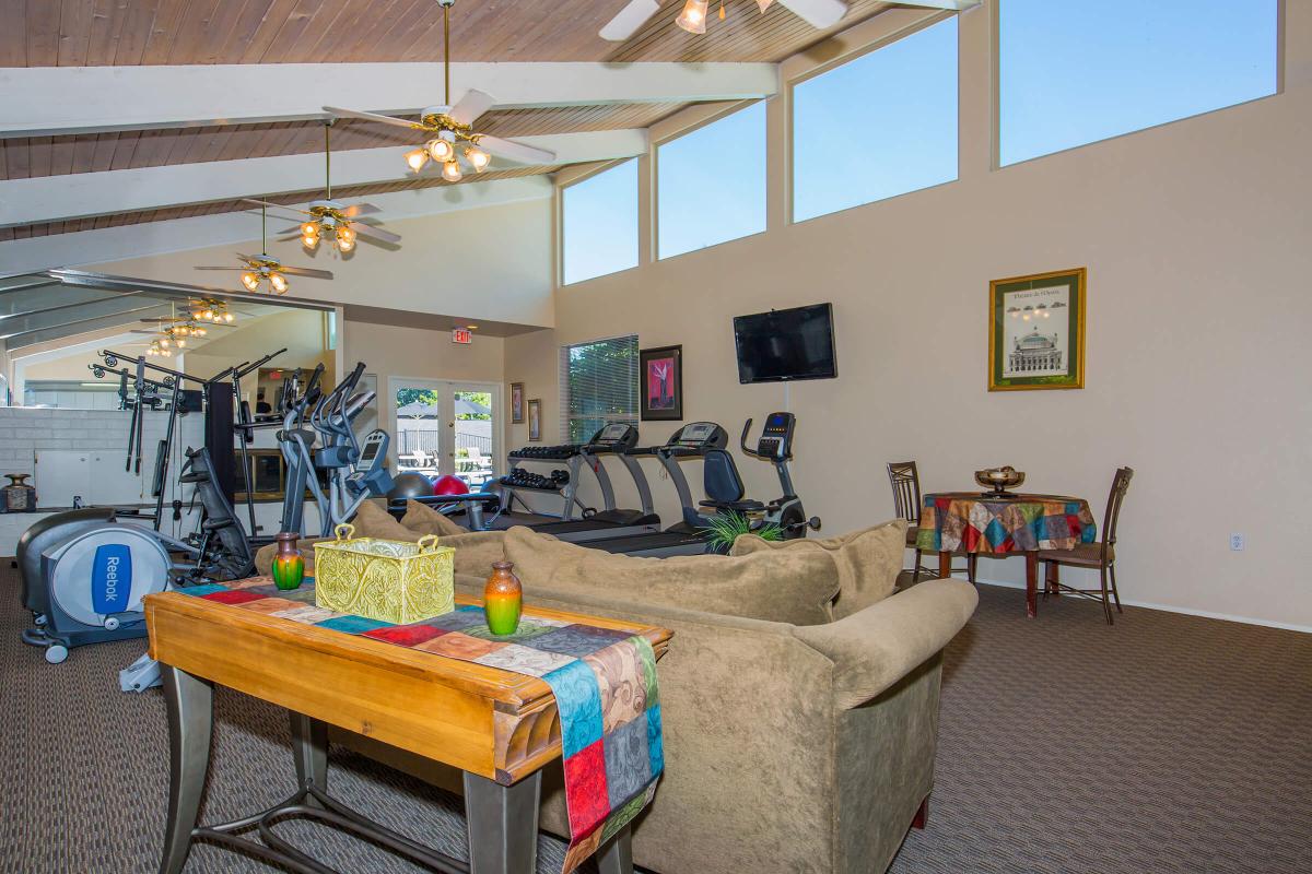 a living room filled with furniture and a table