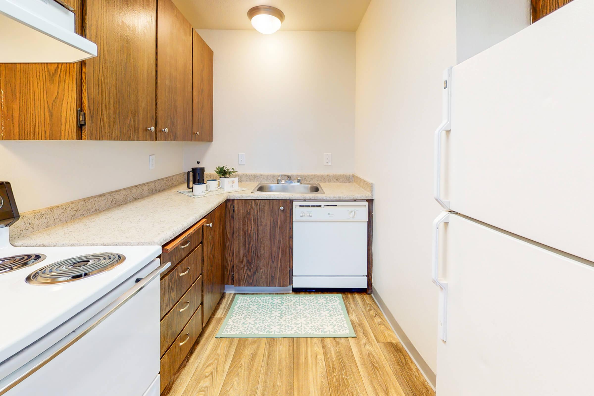 a kitchen with a stove and a refrigerator