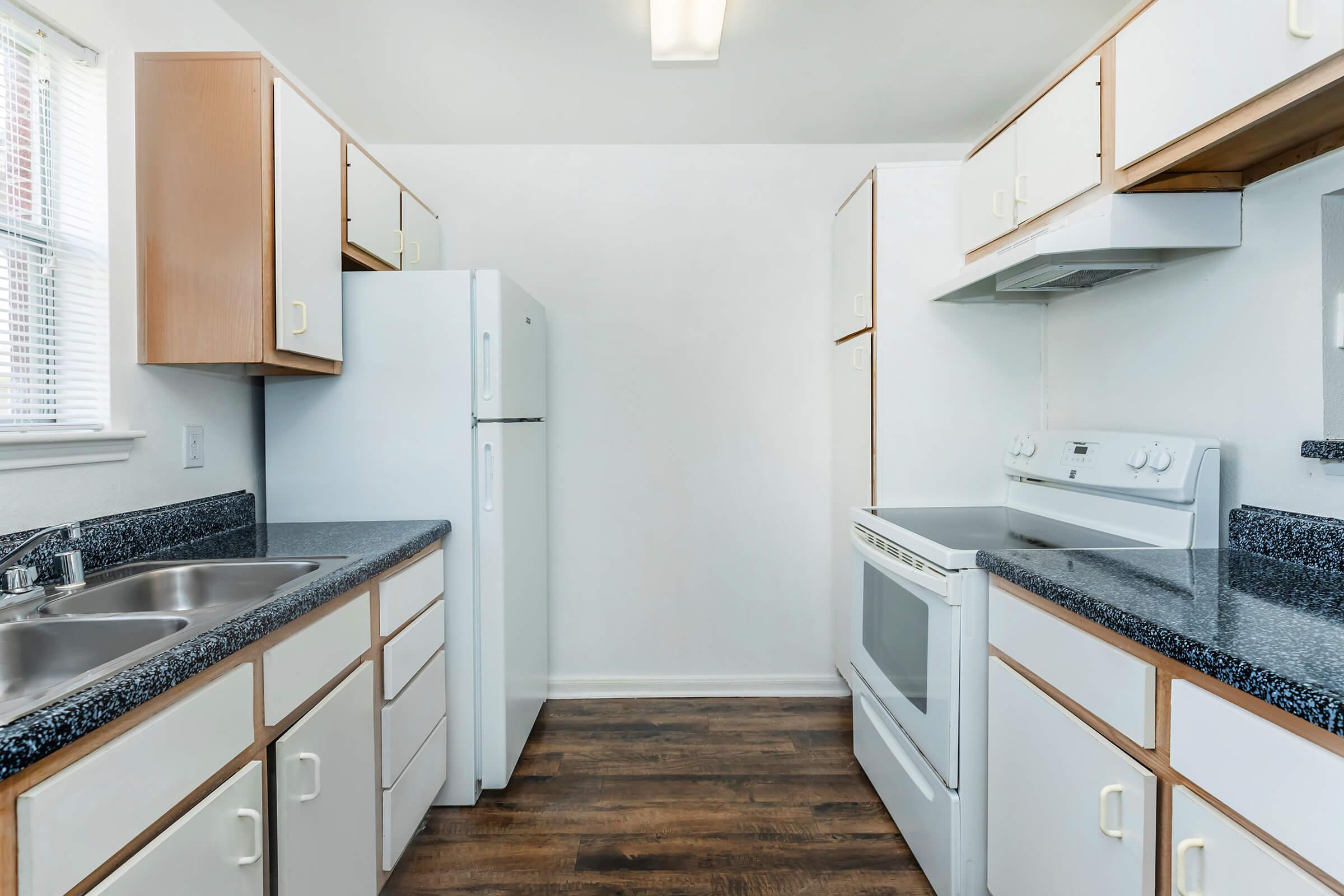 a kitchen with a stove and a sink