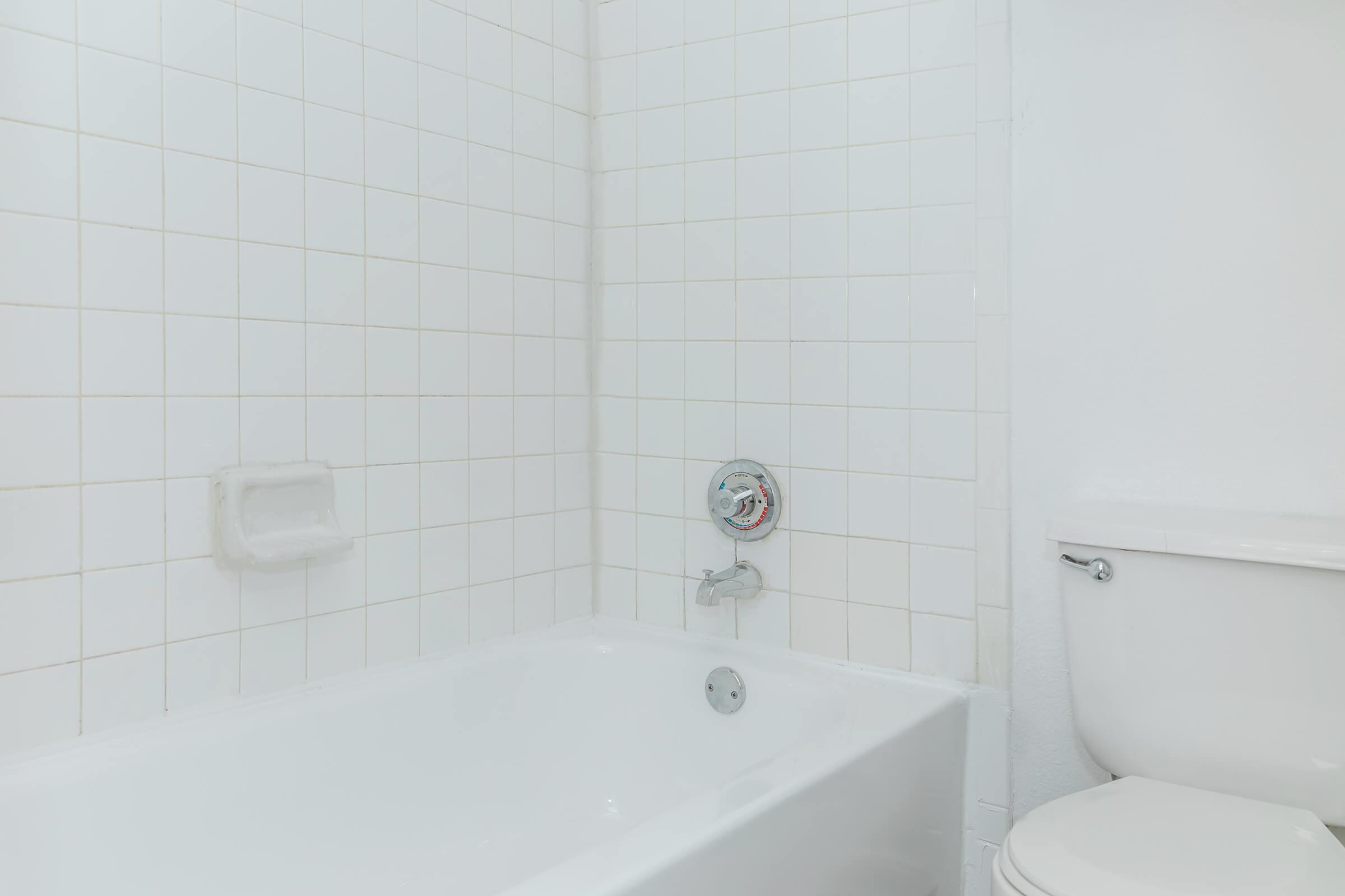 a close up of a sink and a bath tub