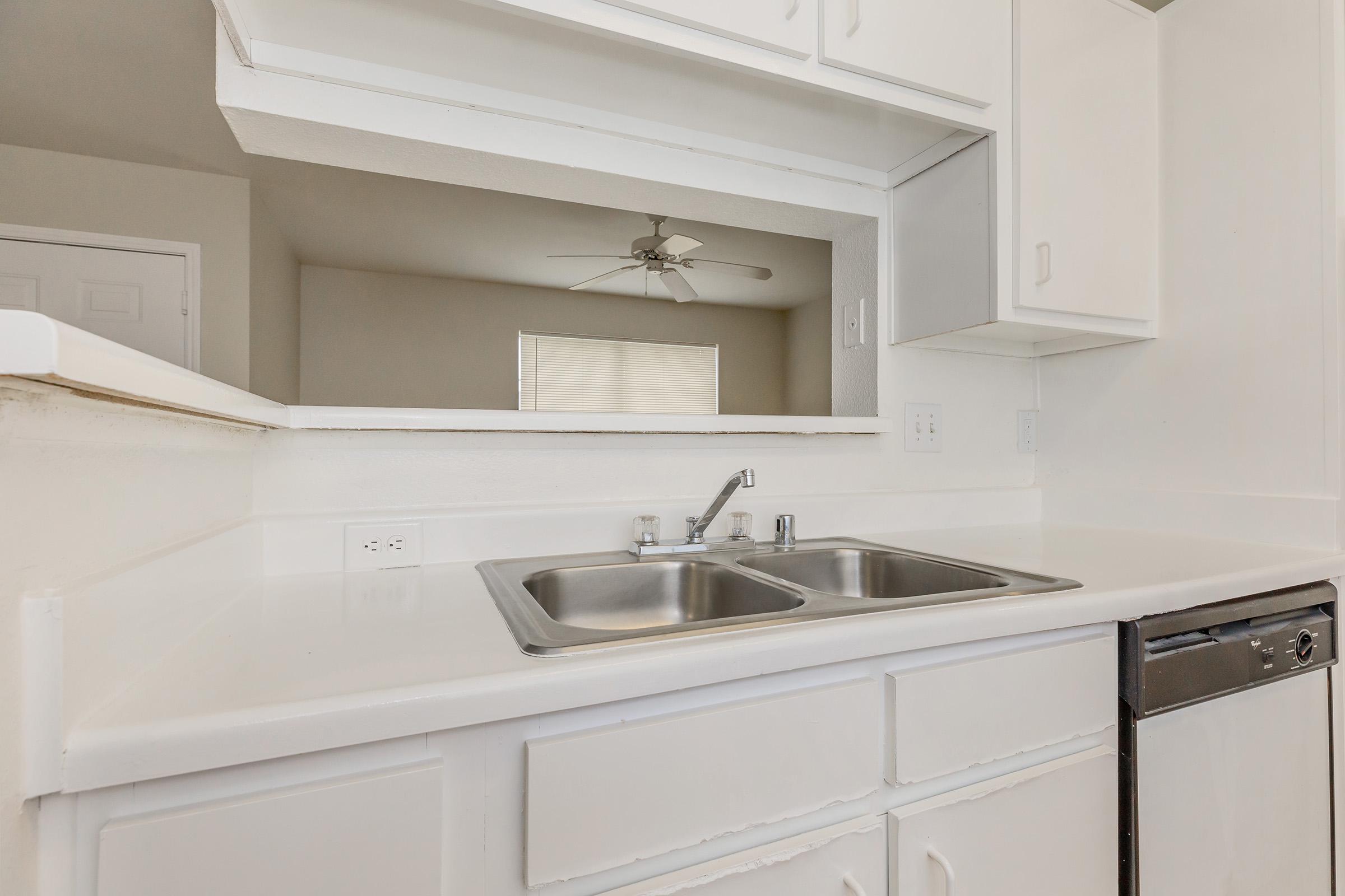 a kitchen with a stove and a sink