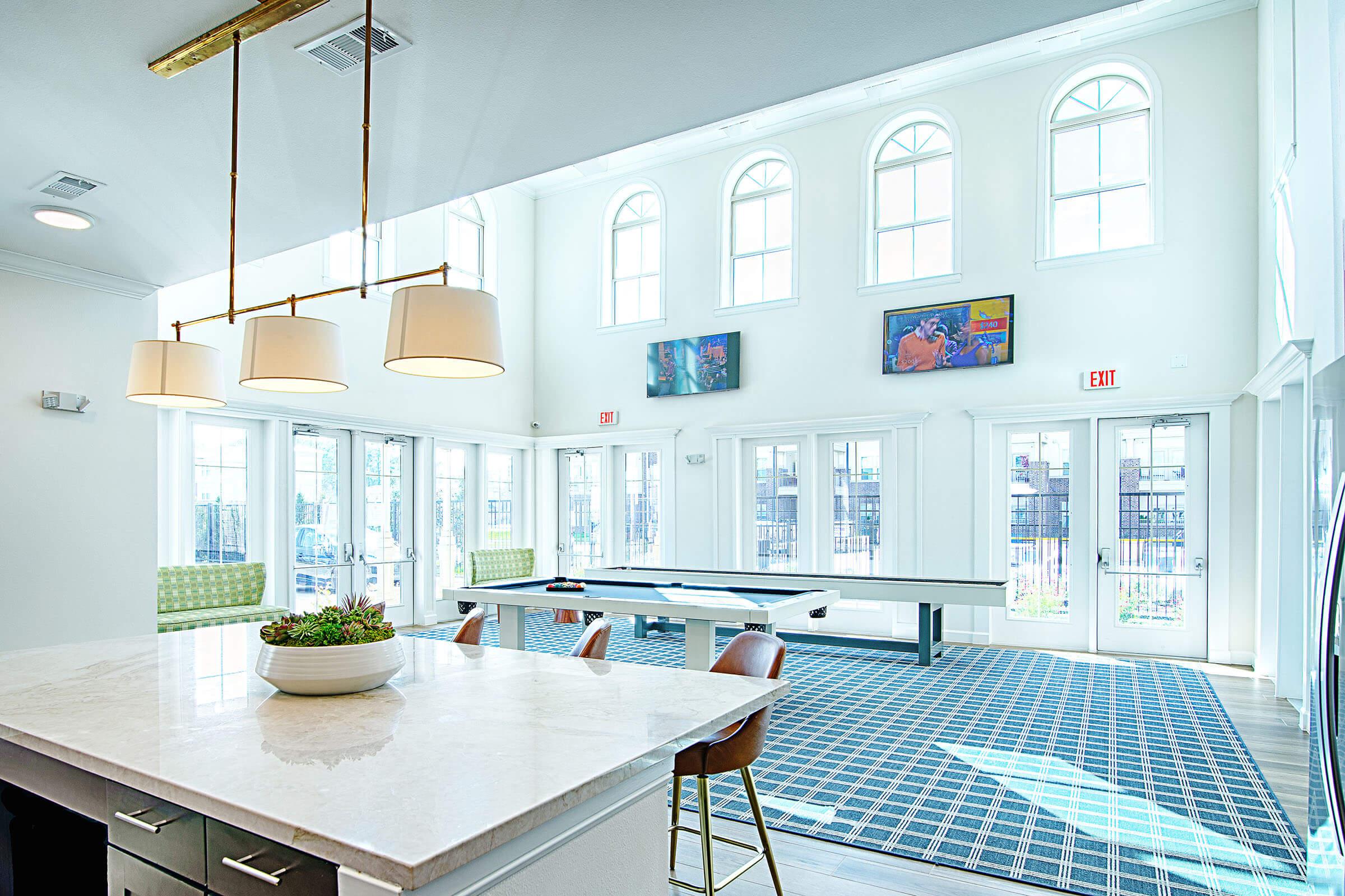 a kitchen with a dining room table