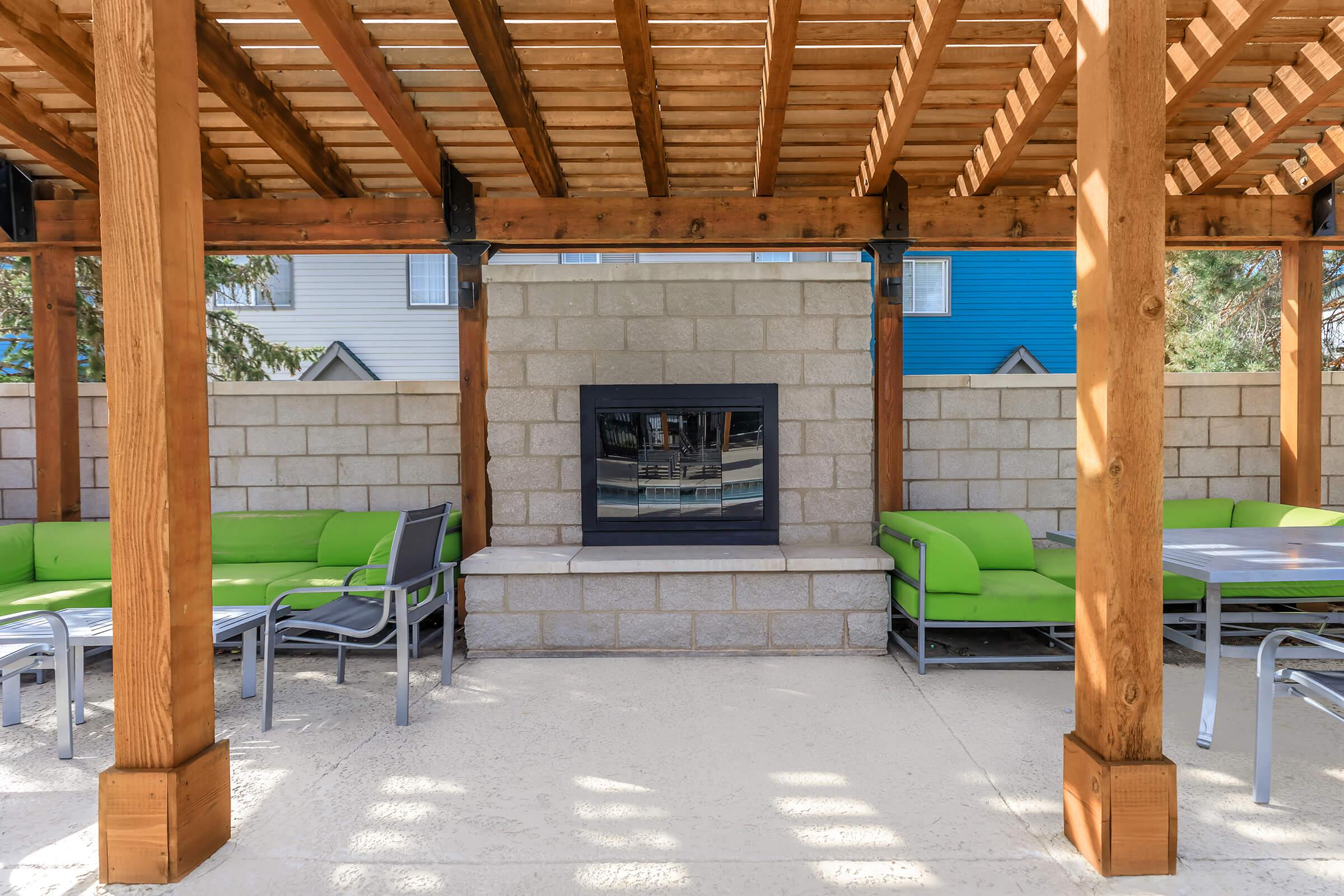 a room filled with furniture and a fire place sitting in a chair