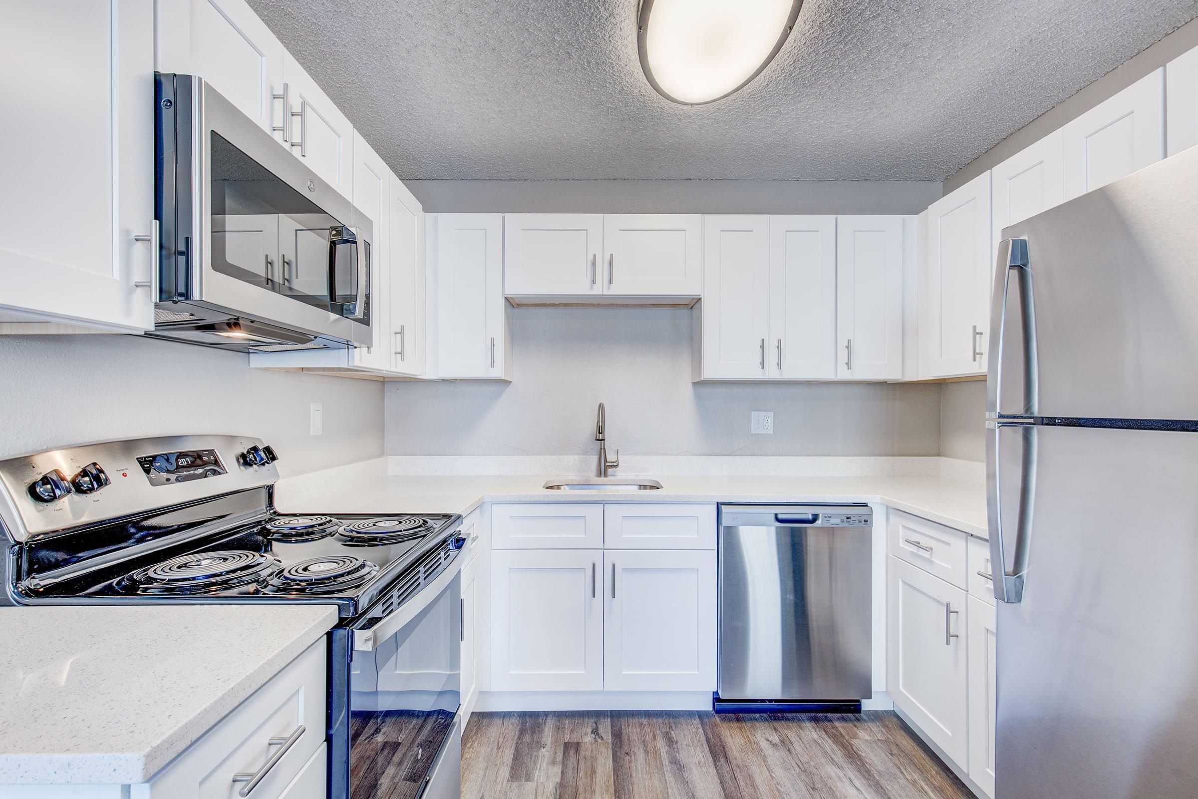 a kitchen with a stove and a refrigerator