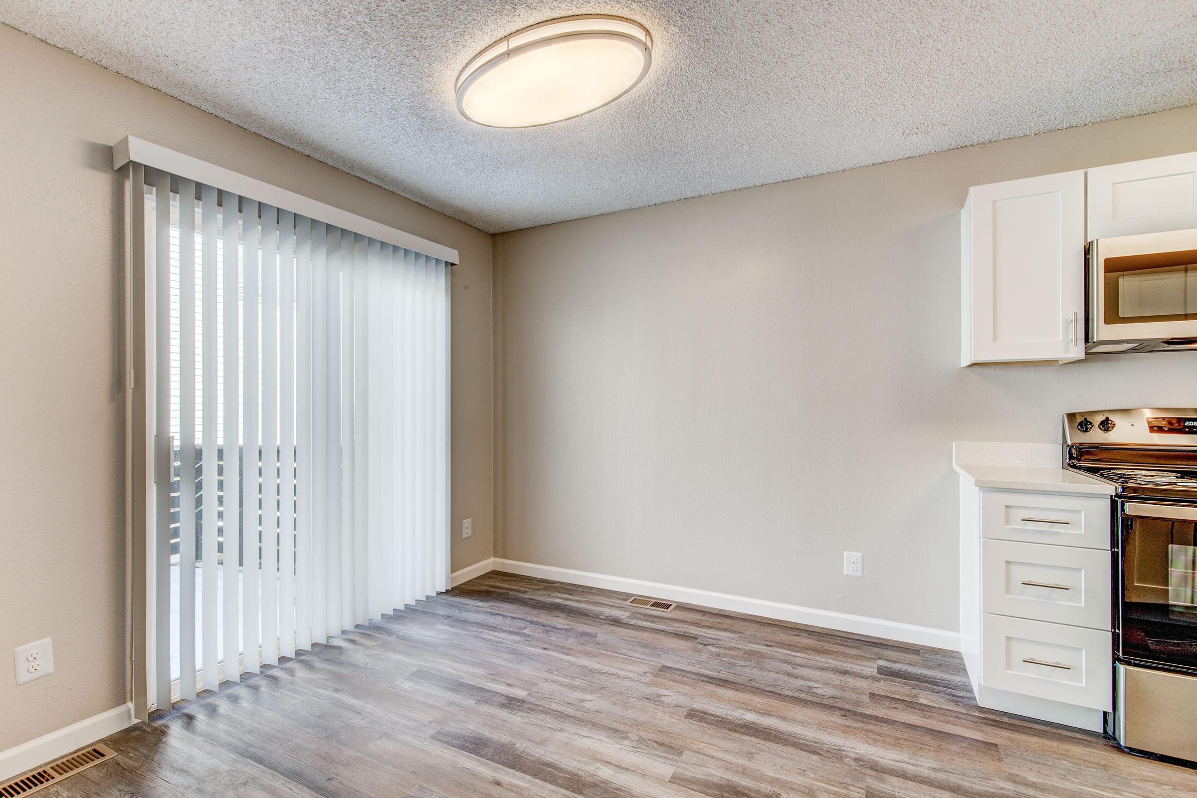 a room with a sink and a microwave