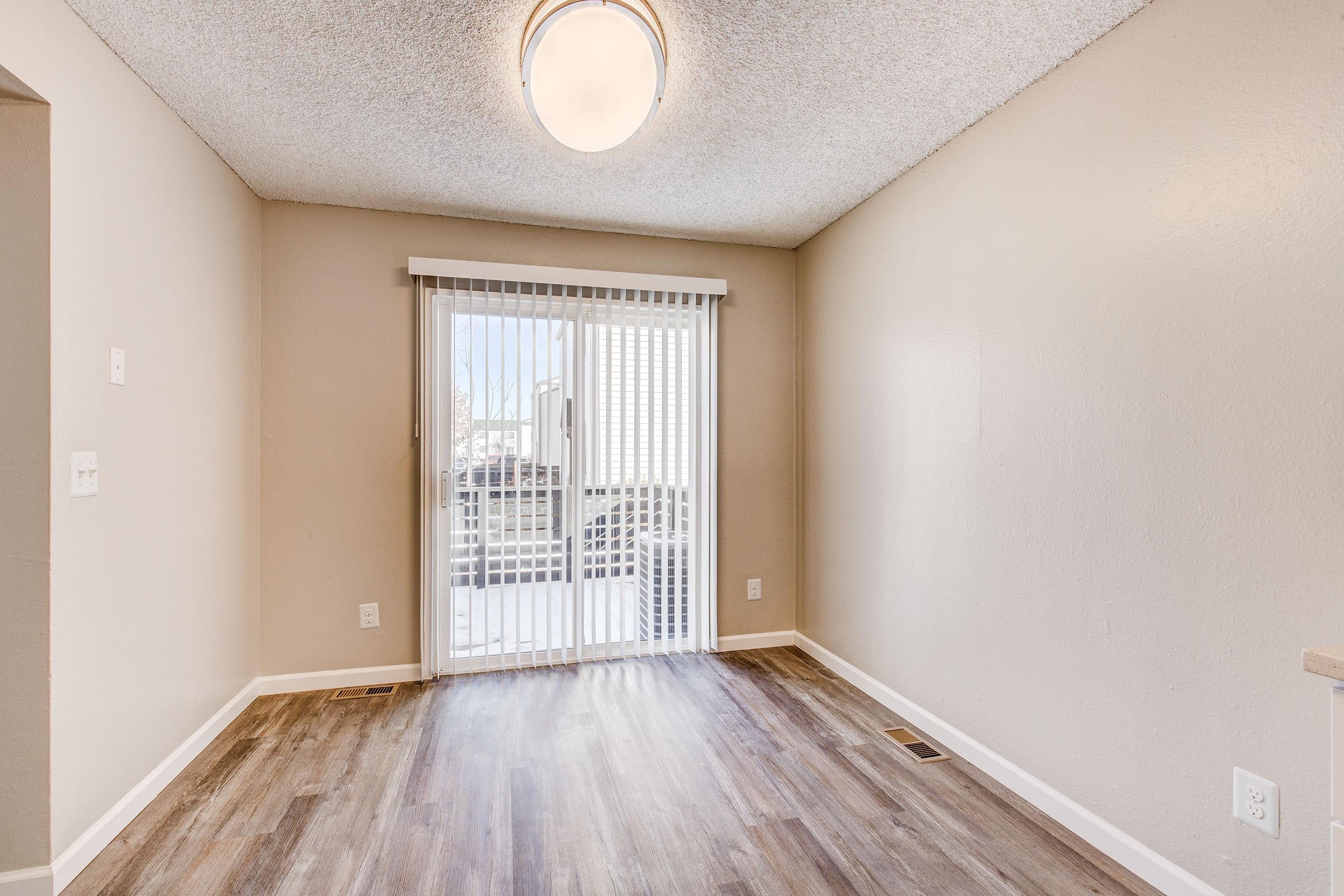 a bedroom with a wooden floor