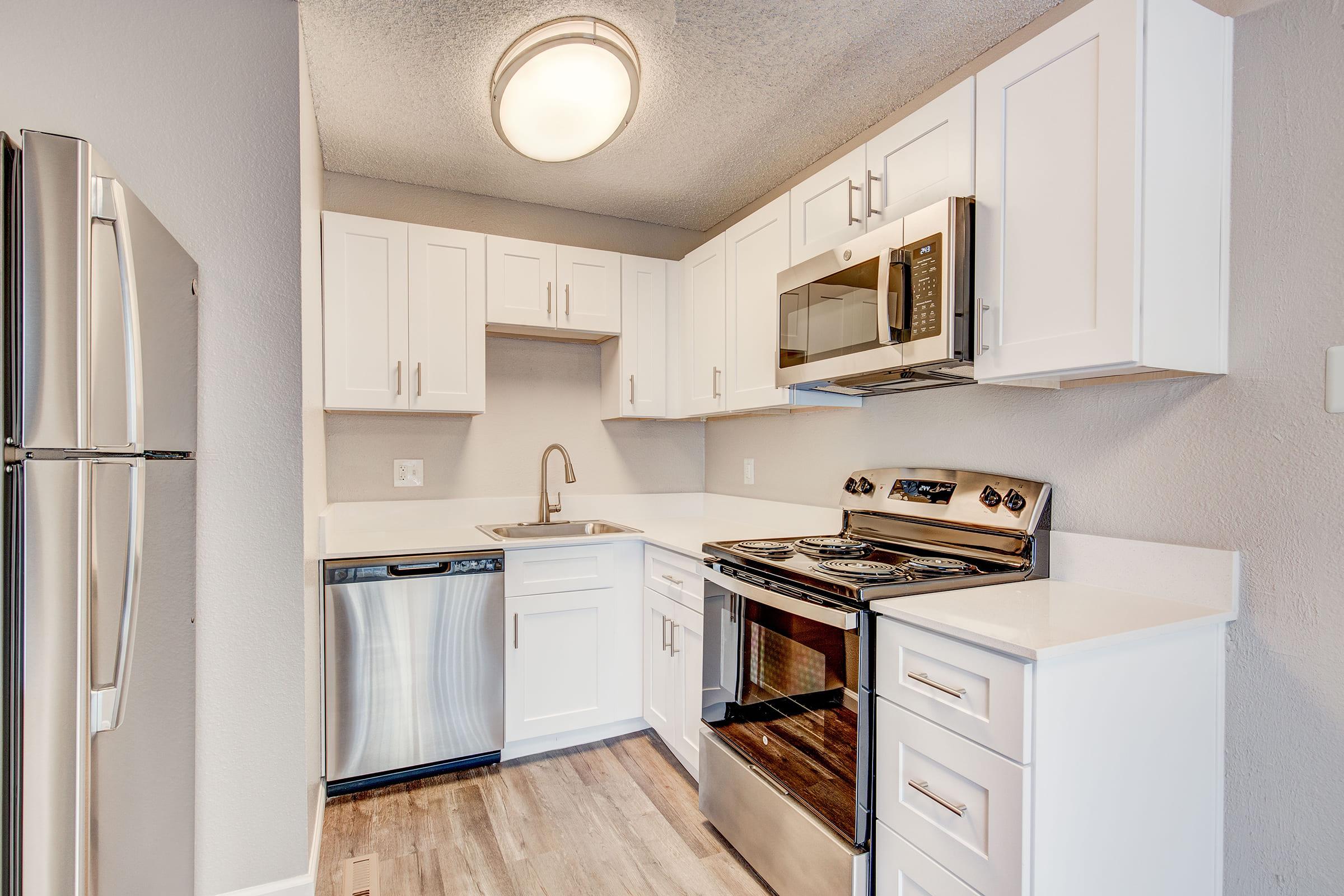 a kitchen with a stove and a refrigerator