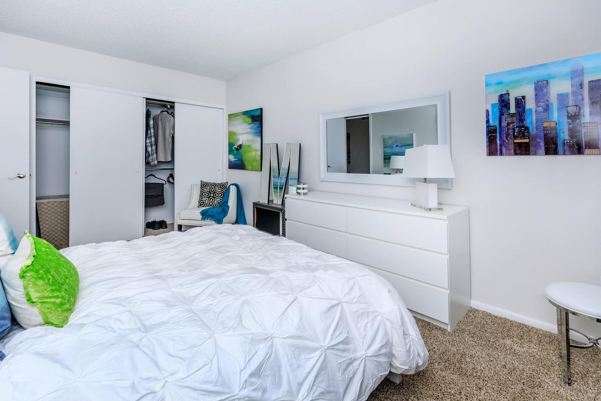 a bedroom with a bed in a room