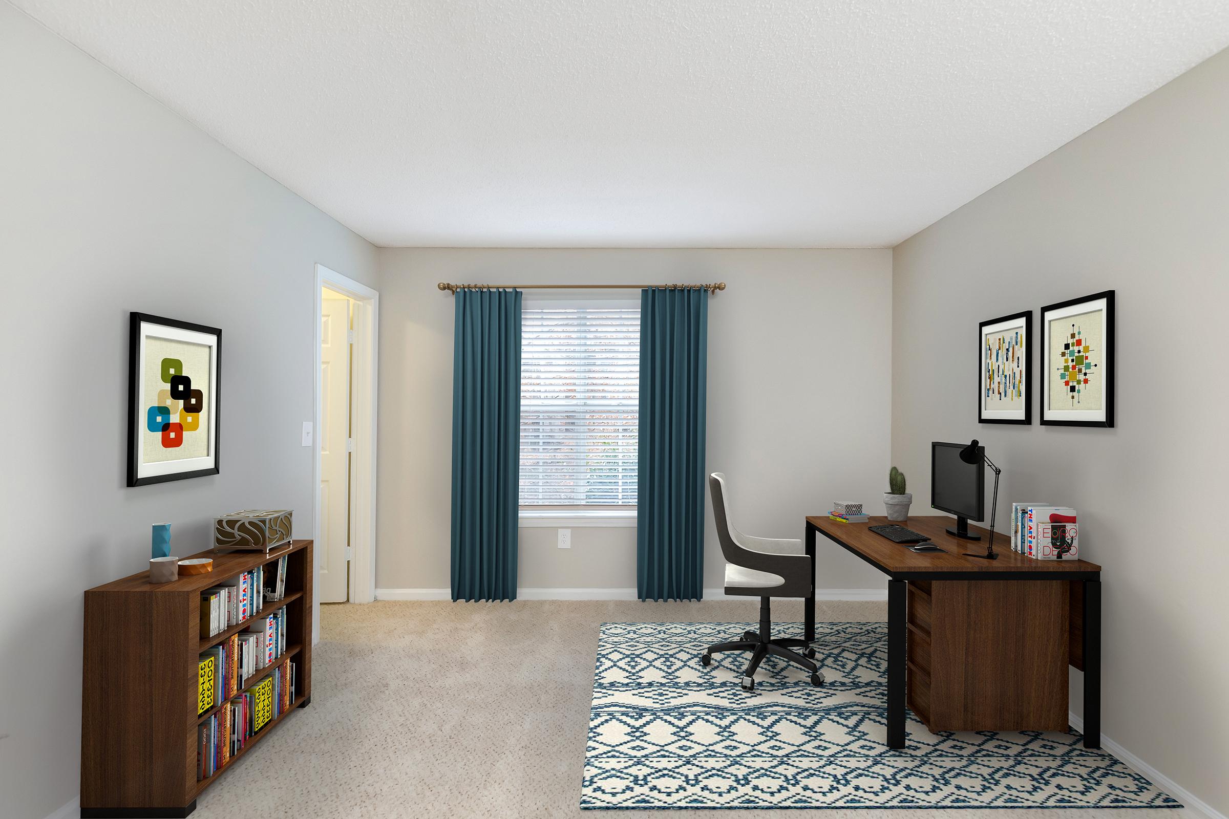 An inviting home office featuring a wooden desk with a computer, a comfortable chair, and decorative elements. A bookshelf filled with books sits against one wall, while a window with blue curtains provides natural light. Two framed artworks add a touch of color, and a soft rug enhances the cozy atmosphere.