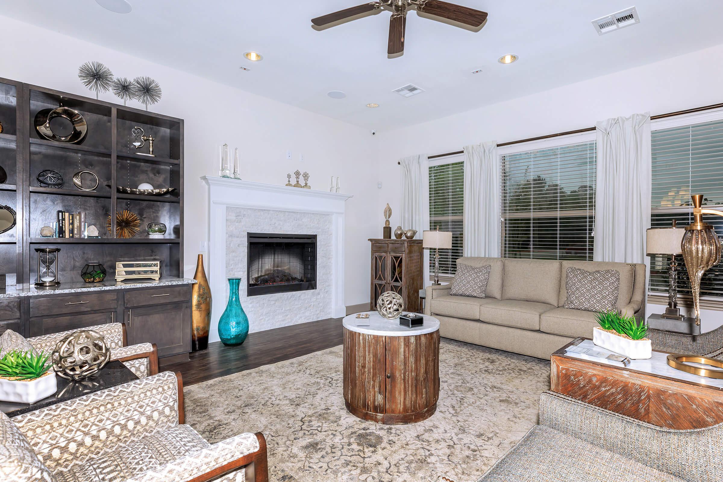 a living room filled with furniture and a fireplace