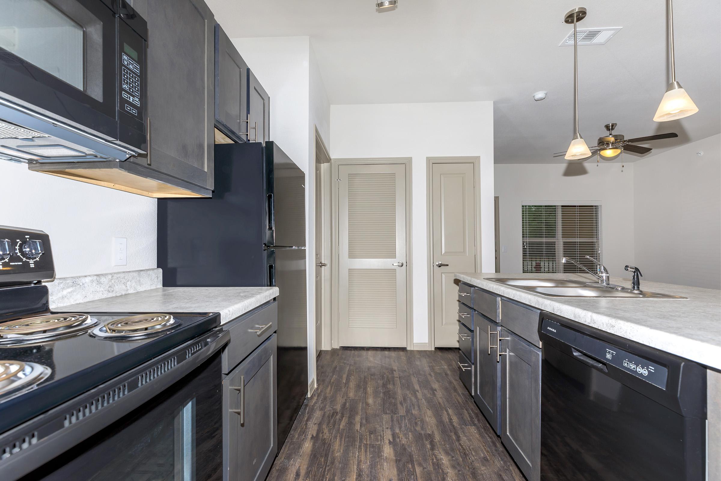 a kitchen with a stove top oven