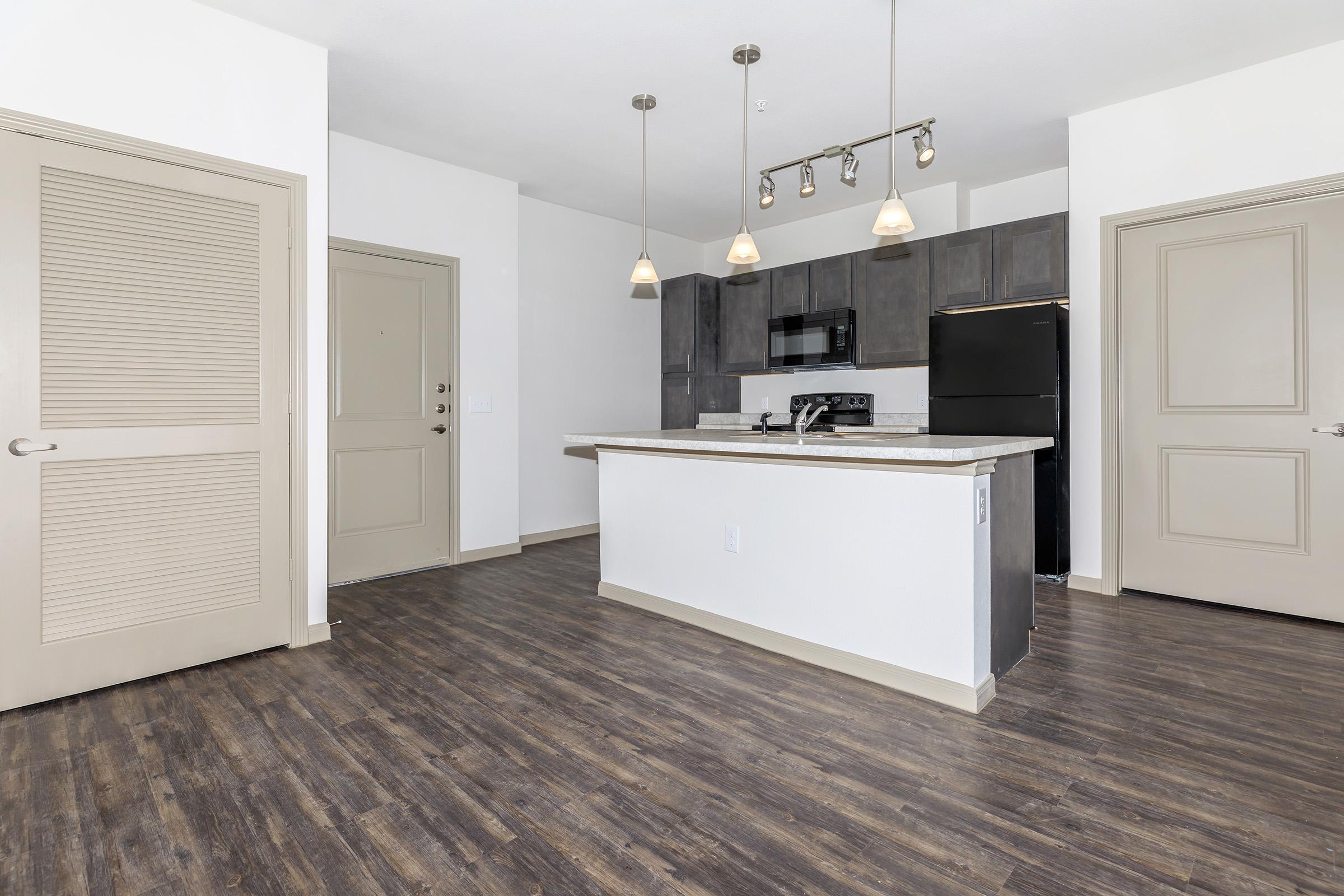 a large white refrigerator in a kitchen