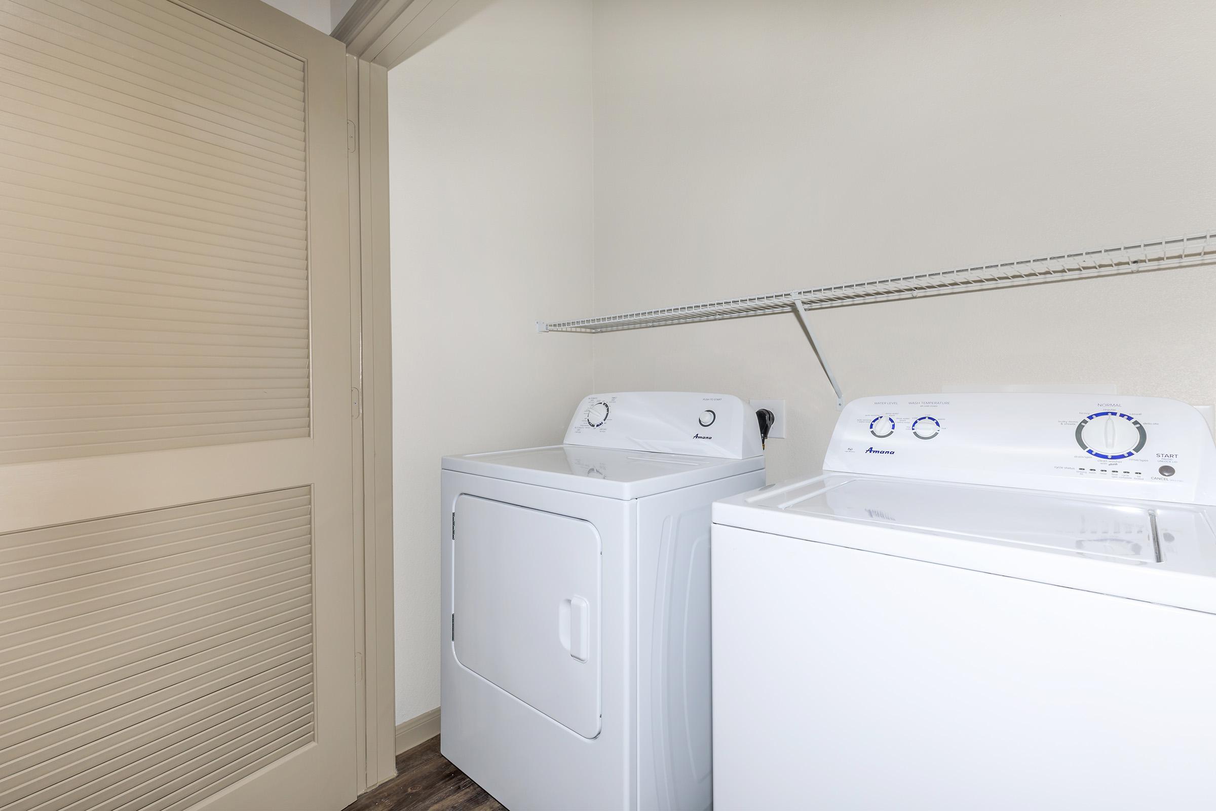 a white refrigerator freezer sitting in a room