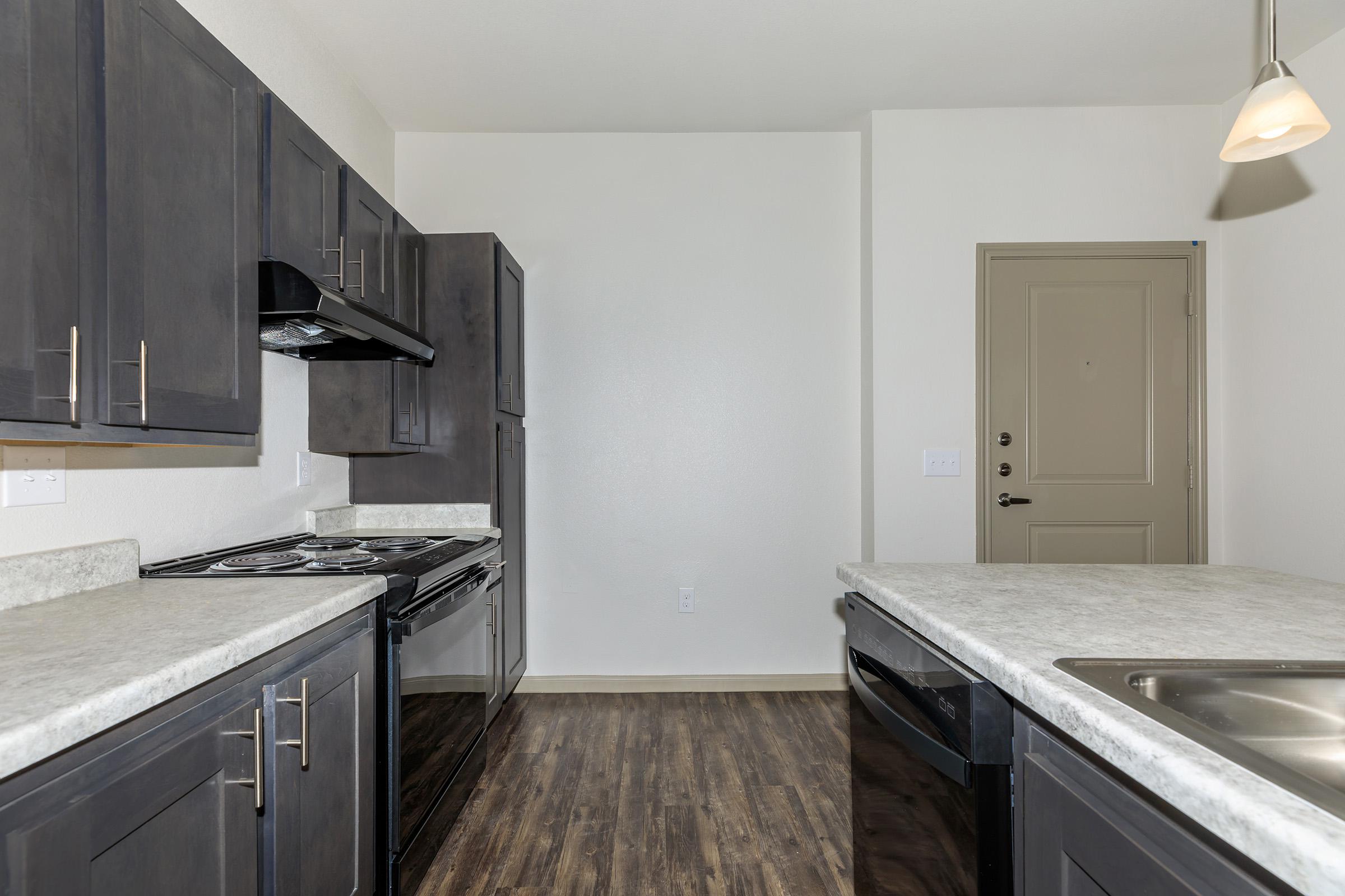 a modern kitchen with stainless steel appliances