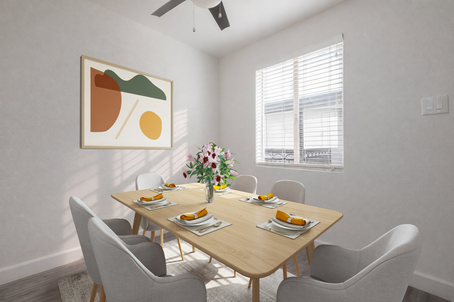 A bright and modern dining room featuring a light wood table set for six, each place adorned with plates and yellow fruit. A floral centerpiece sits in a glass vase. The walls are painted in soft tones, complemented by an abstract art piece. Natural light streams through a window, enhancing the inviting atmosphere.