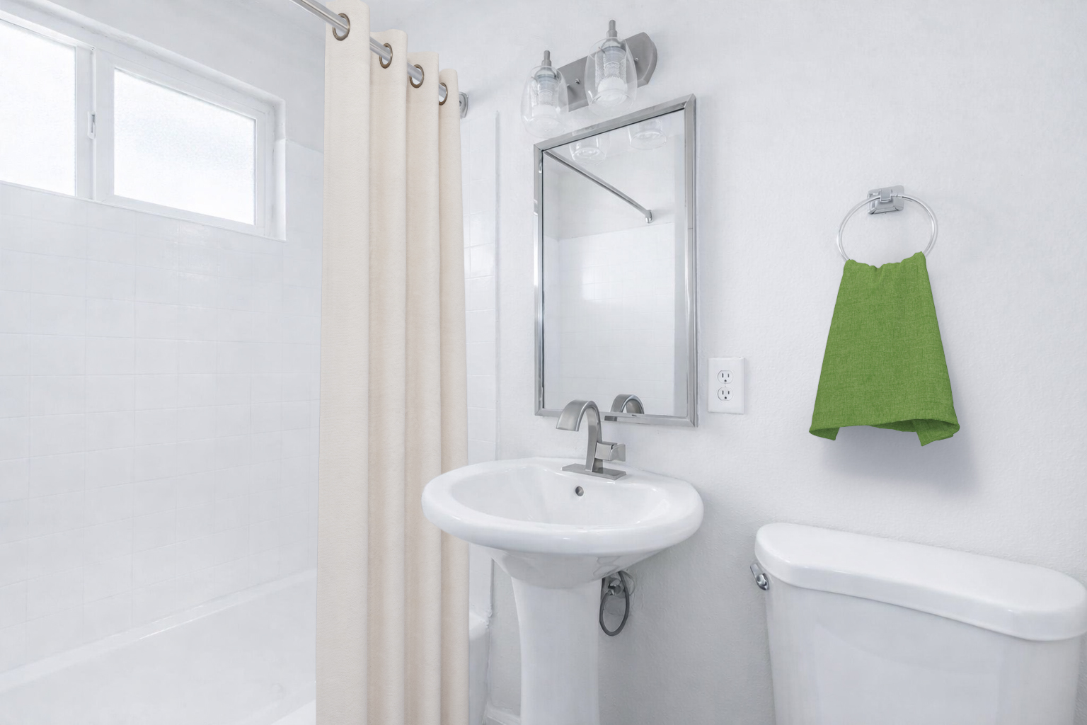 A modern bathroom featuring a white tiled shower area, a pedestal sink with a mirror above, and a toilet. The bathroom has light-colored walls, a beige shower curtain, and a green hand towel hanging on a wall-mounted holder. Natural light enters through a small window.