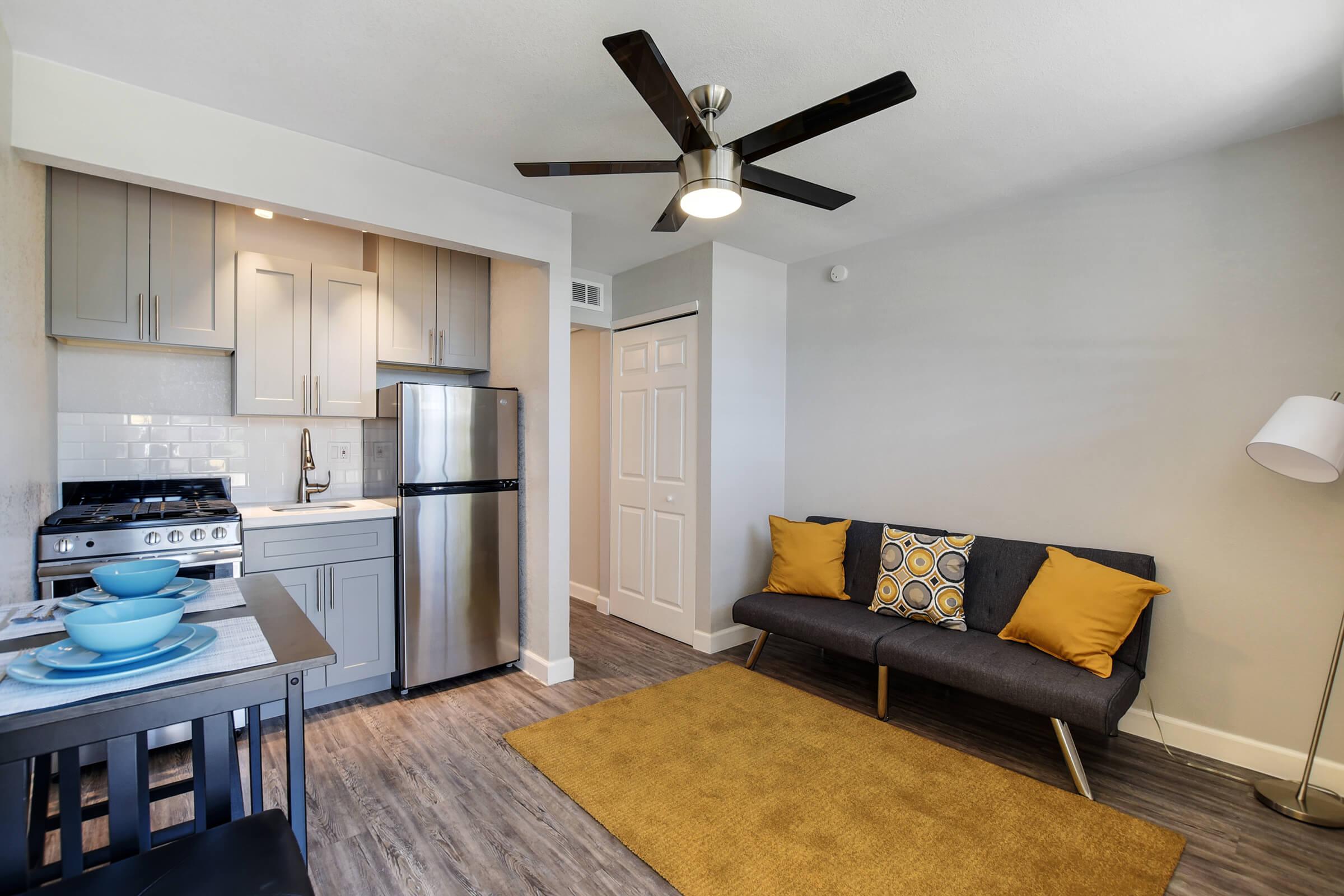 a living room filled with furniture and a stove