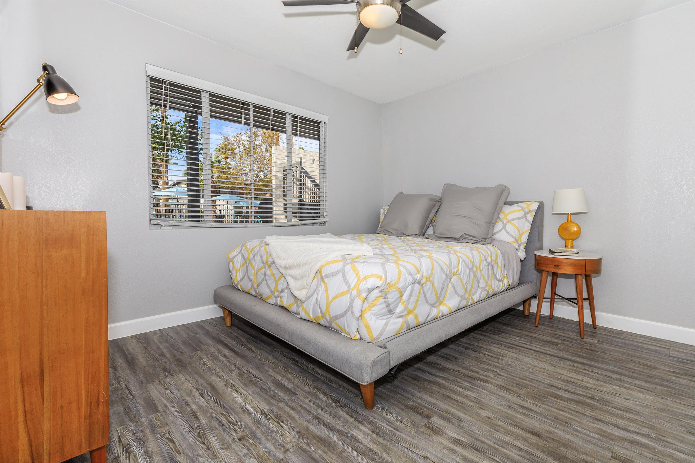 The bedrooms come with custom window treatments and ceiling fans.