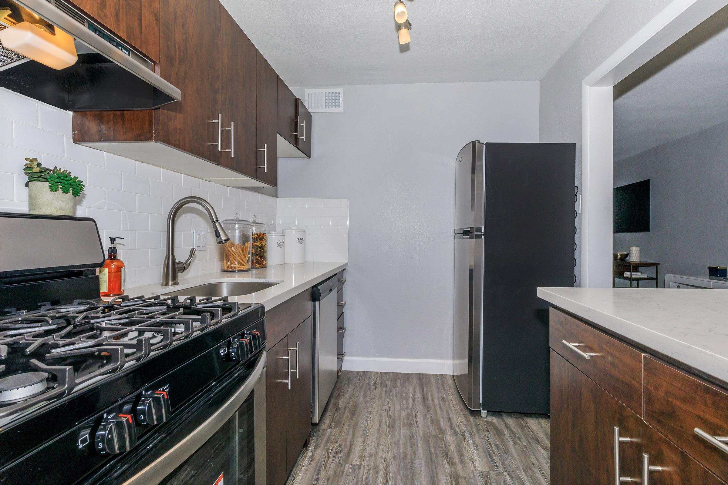 The Wexlers stainless steel kitchen with quartz countertops.