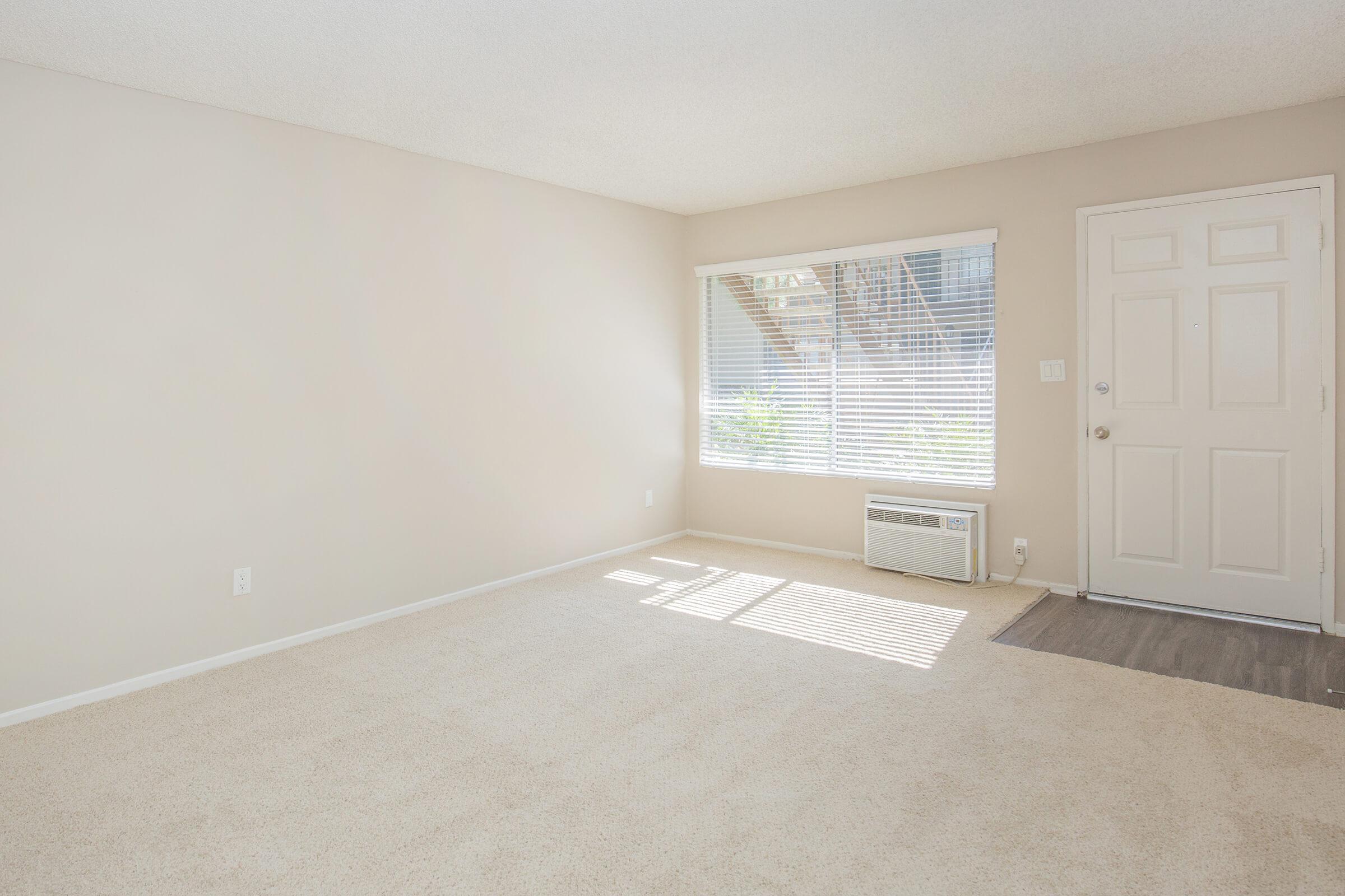 Unfurnished living room with carpet