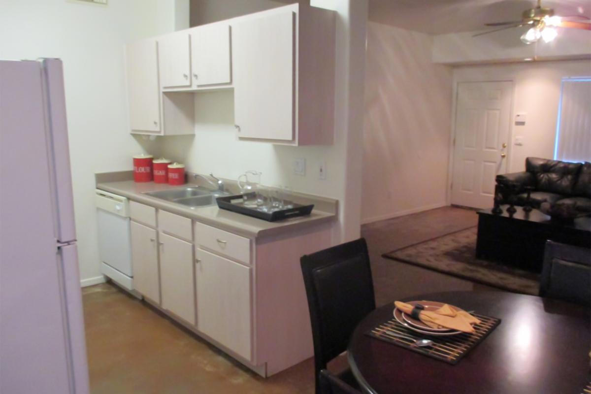 a kitchen with a stove top oven sitting inside of a room