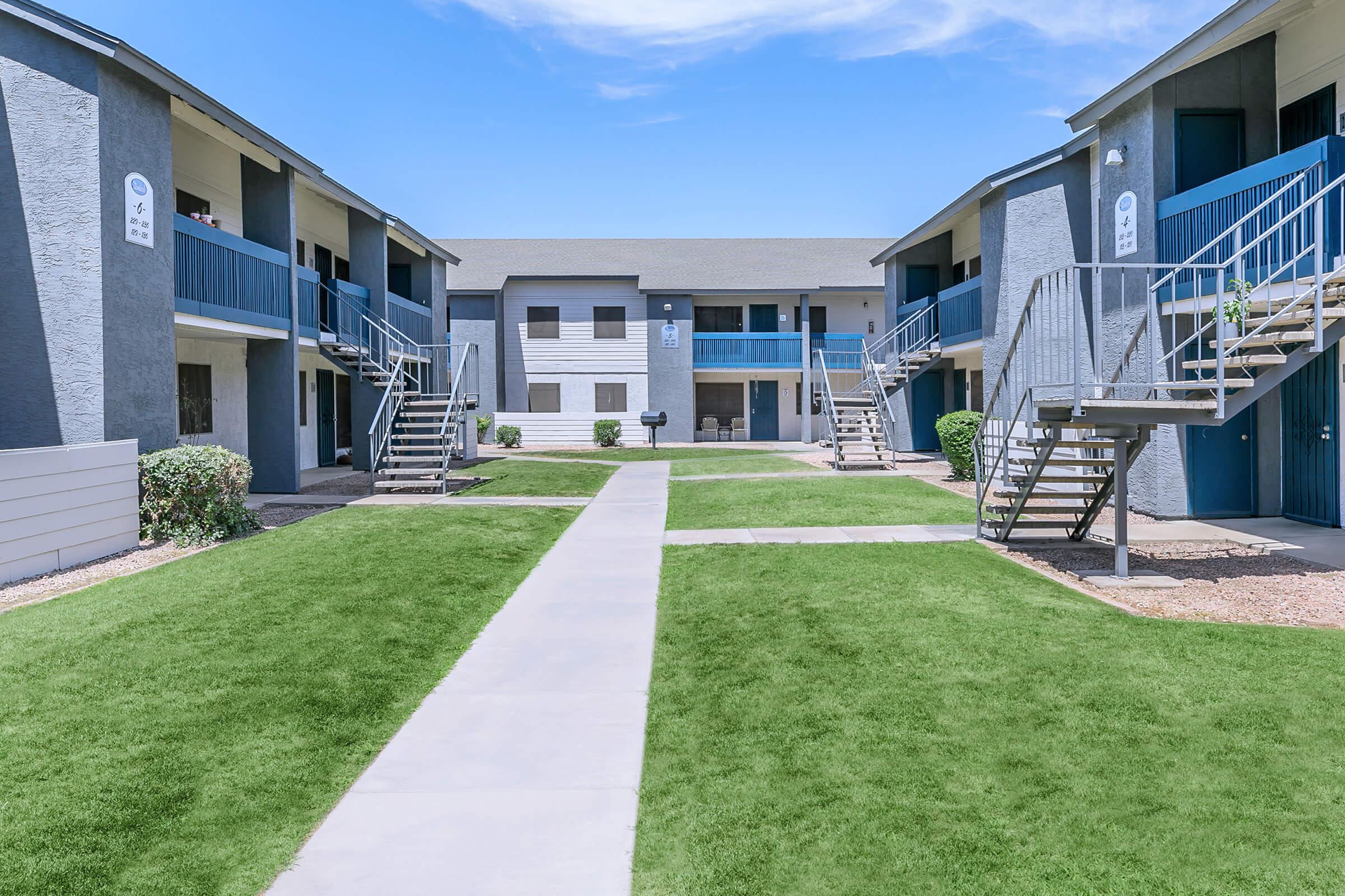 A landscaped pathway in between the apartments at Rise Northridge.