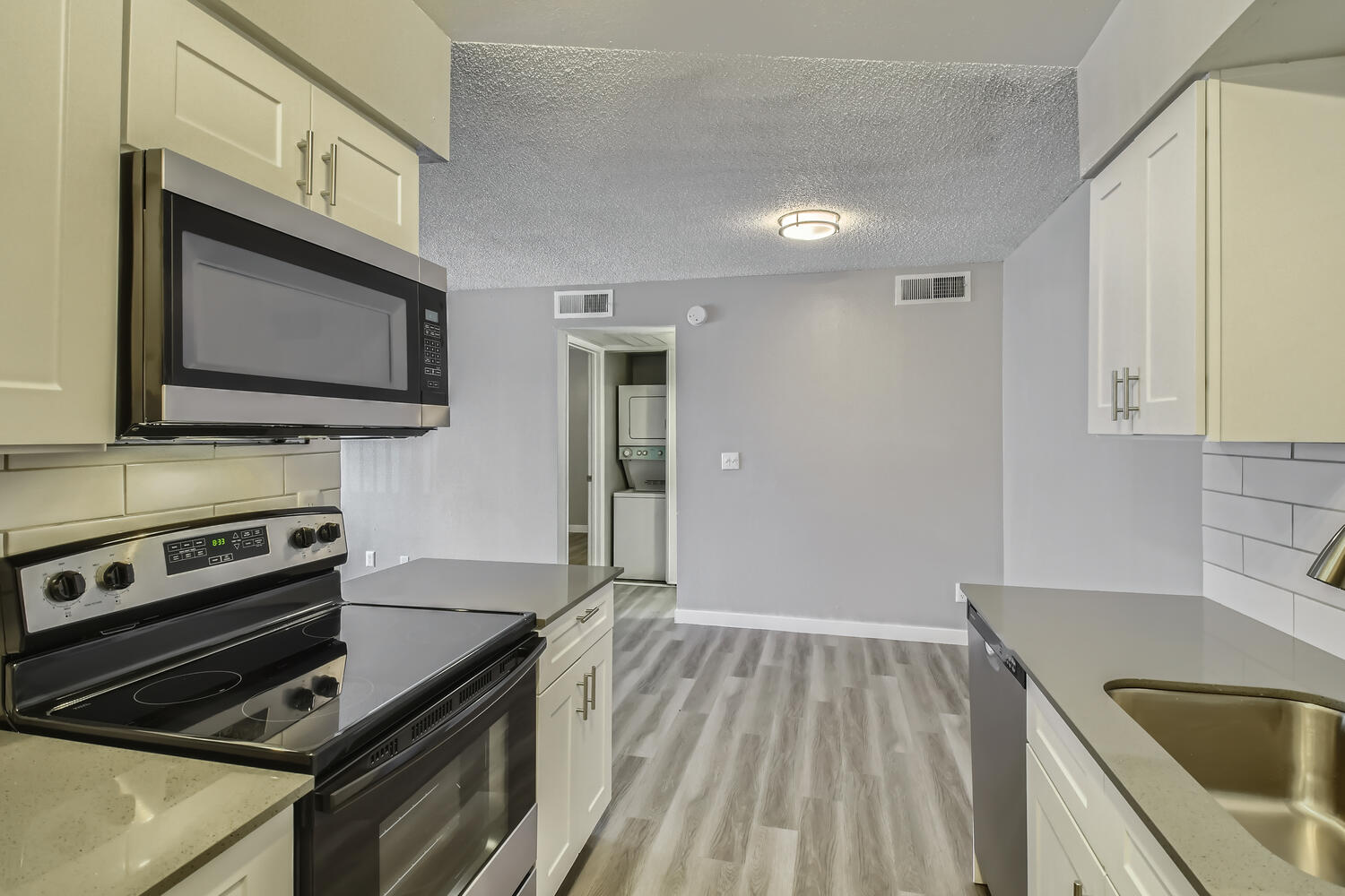 A kitchen at Rise North Ridge apartments near the dining area.
