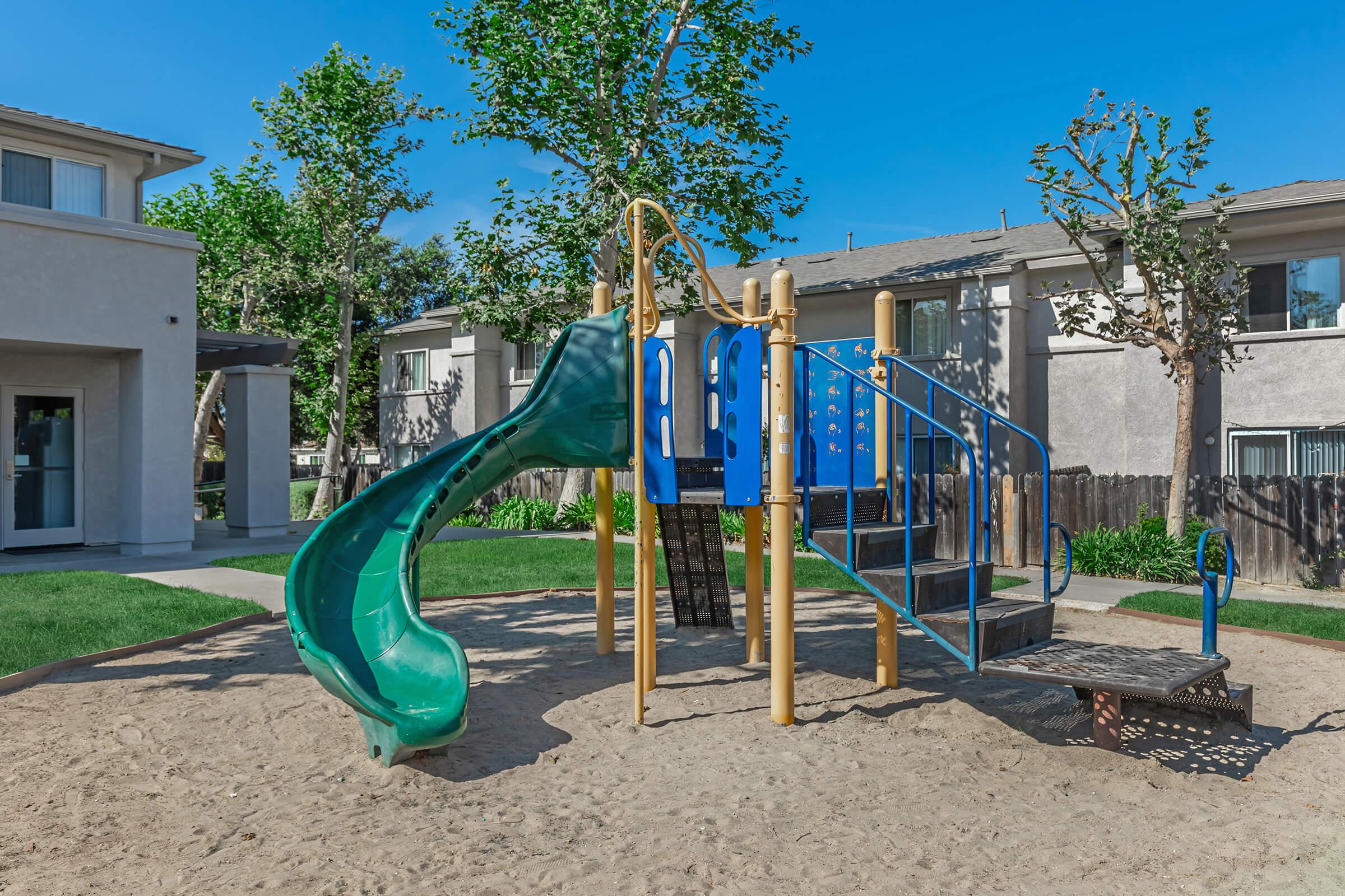 a playground in front of a house