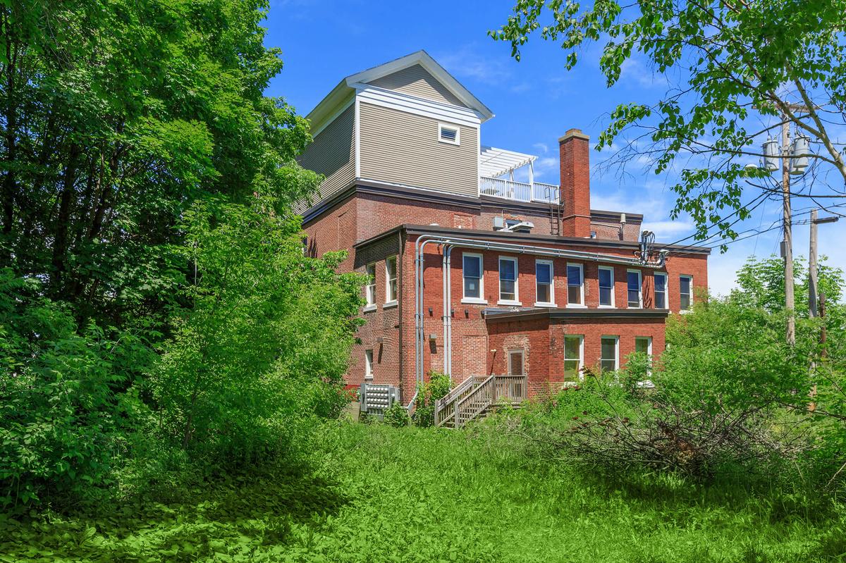 a large brick building with a clock tower