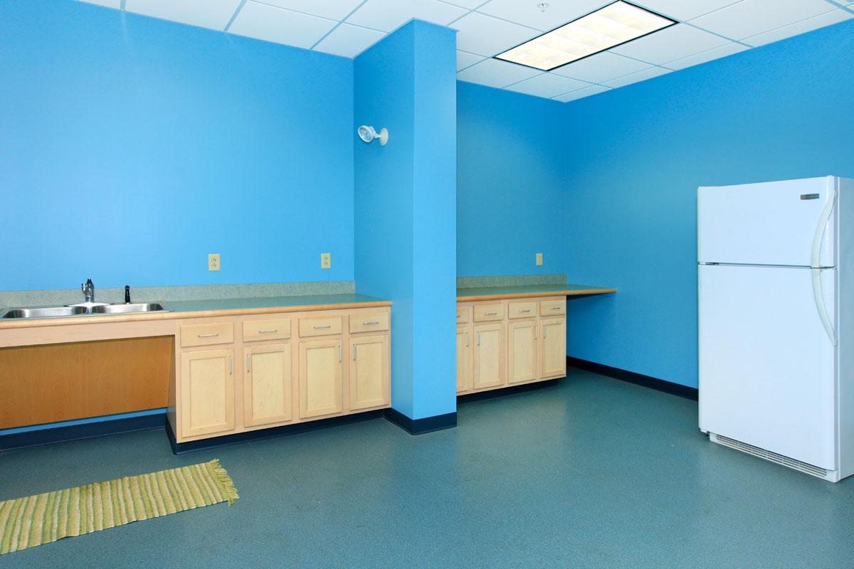 a kitchen with a blue background