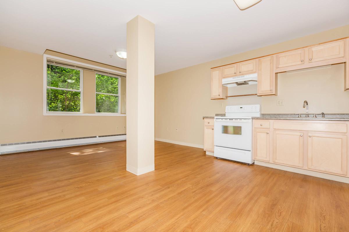 a kitchen with a hard wood floor