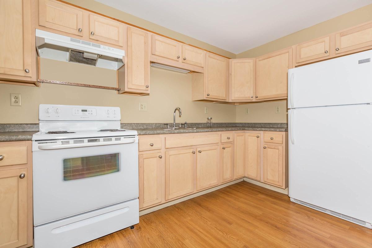 a kitchen with a stove top oven sitting inside of a refrigerator