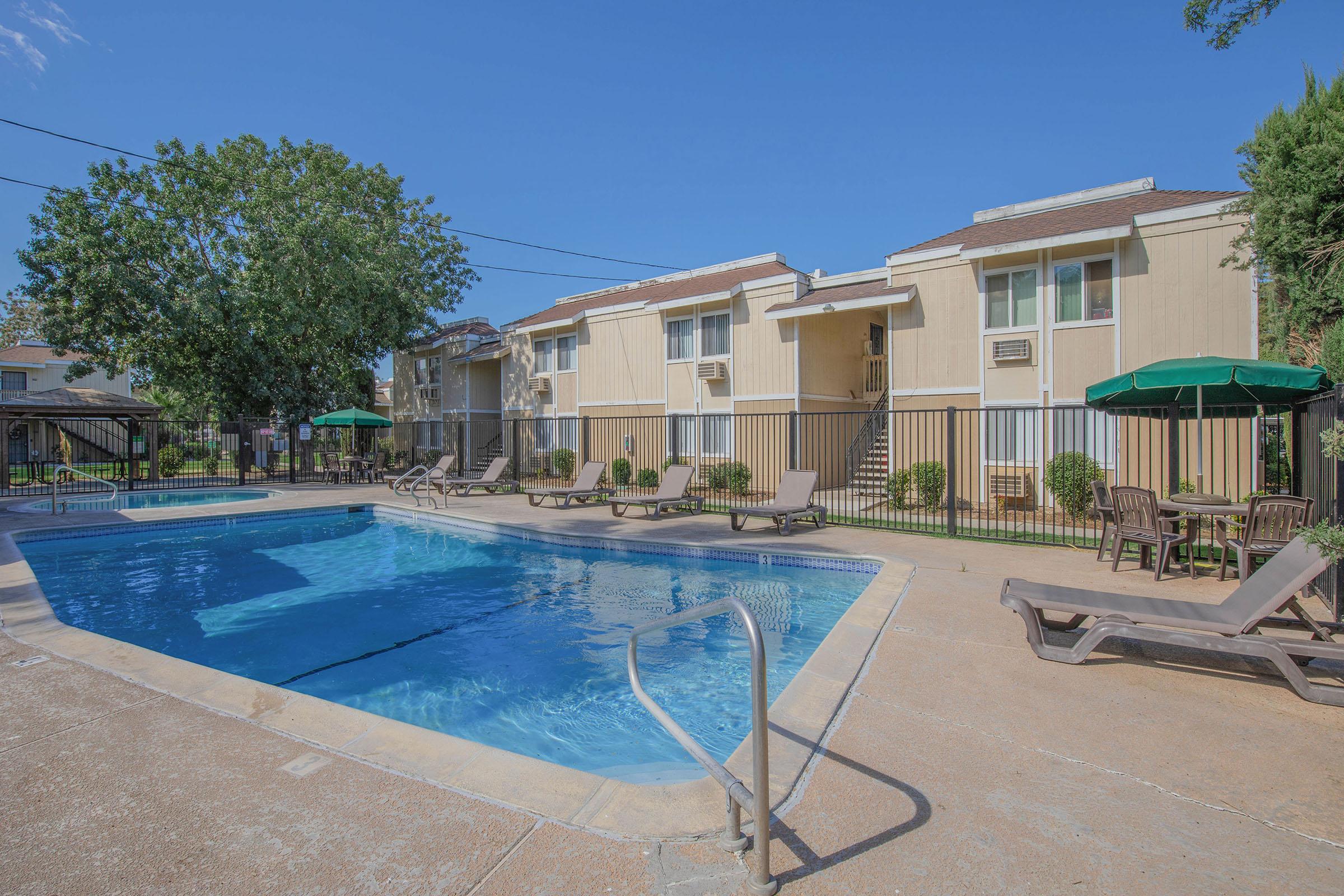 a house with a pool outside of a building