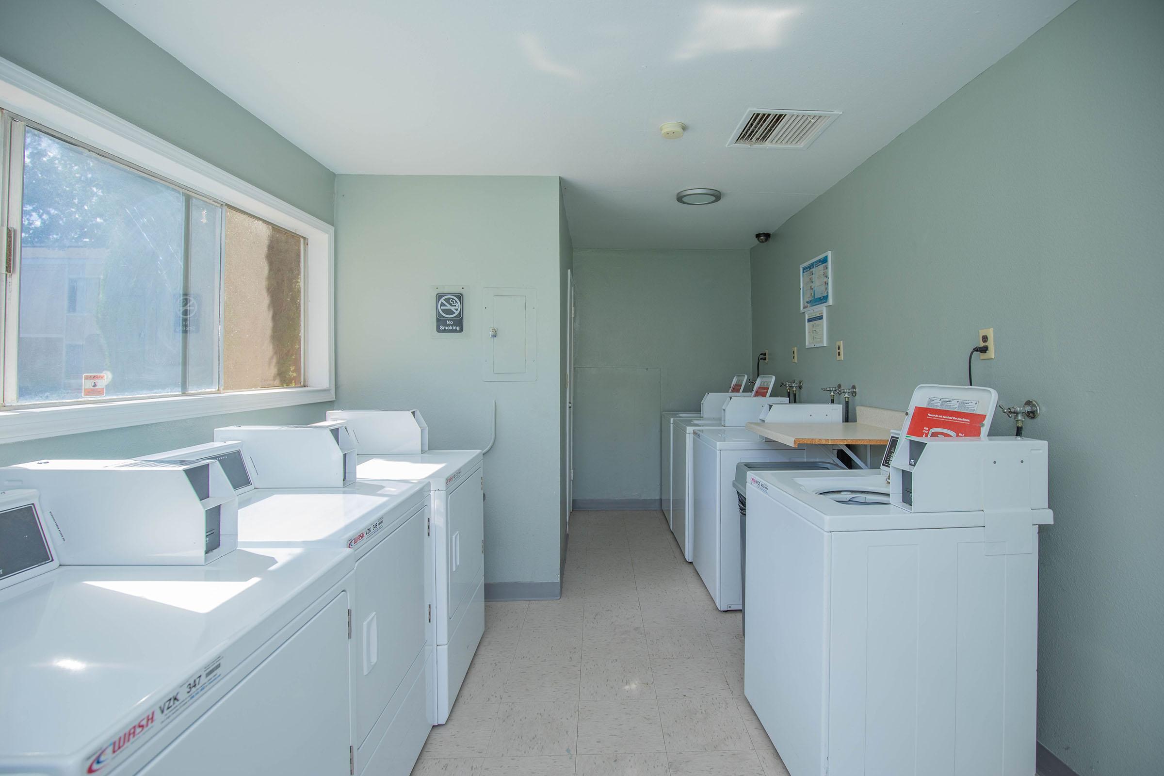 a kitchen with a sink and a refrigerator