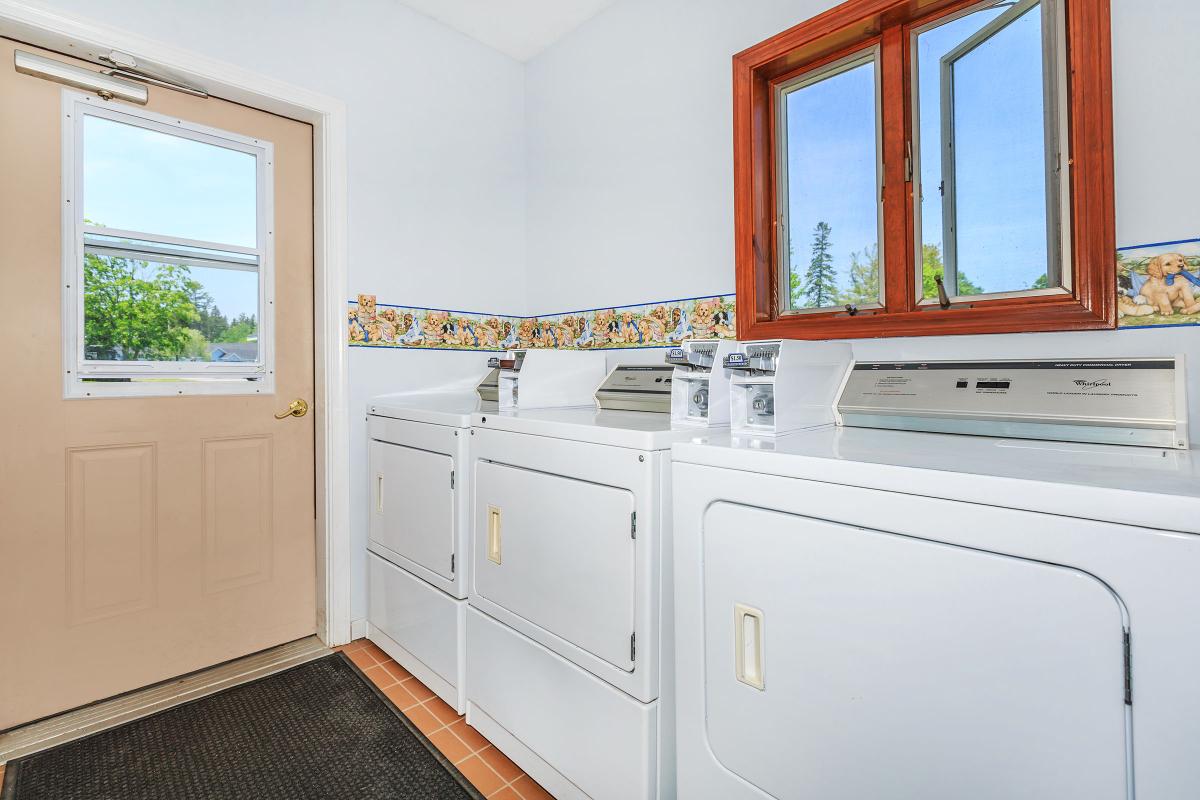 a kitchen with a sink and a window