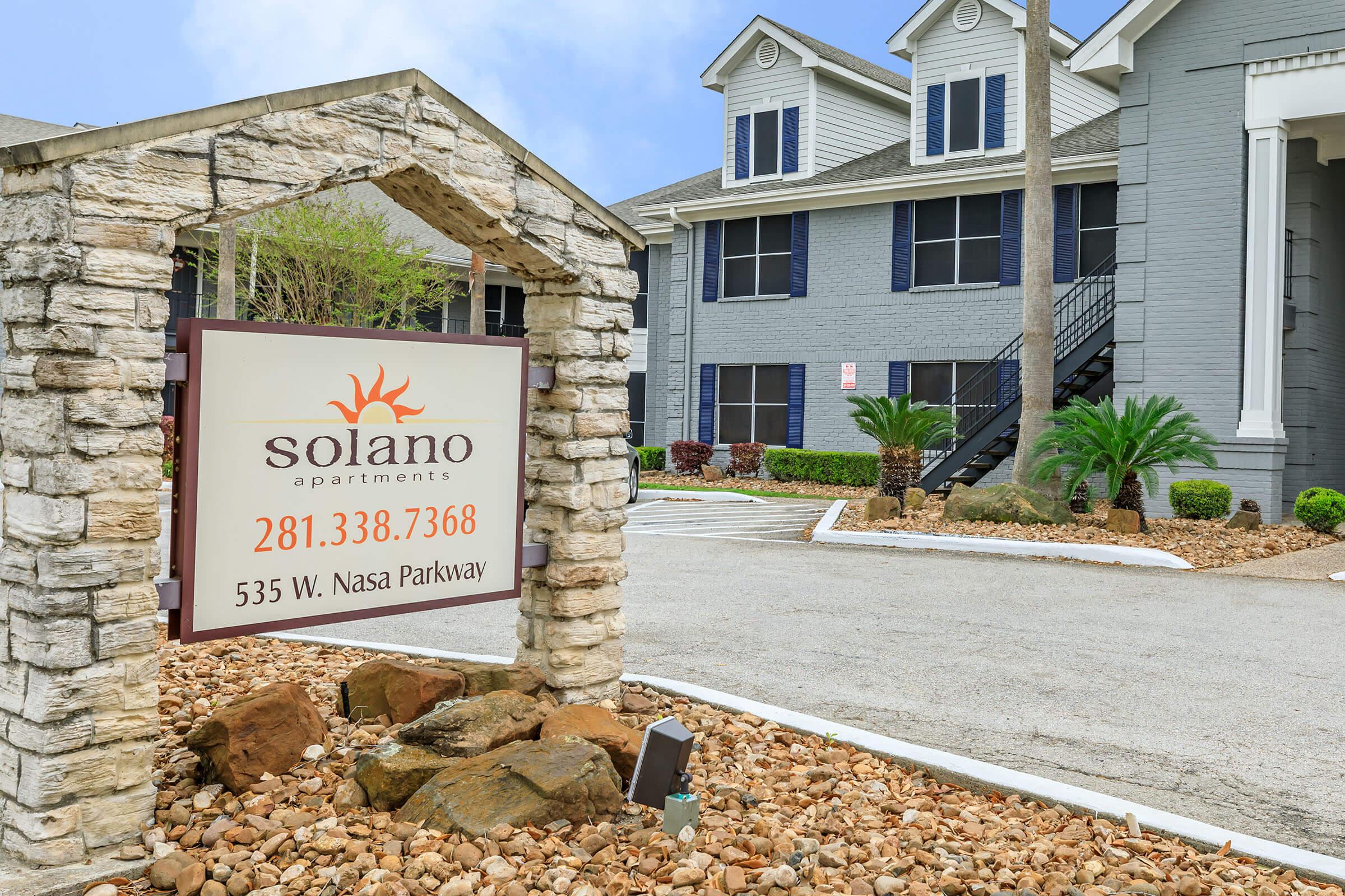 a sign in front of a house