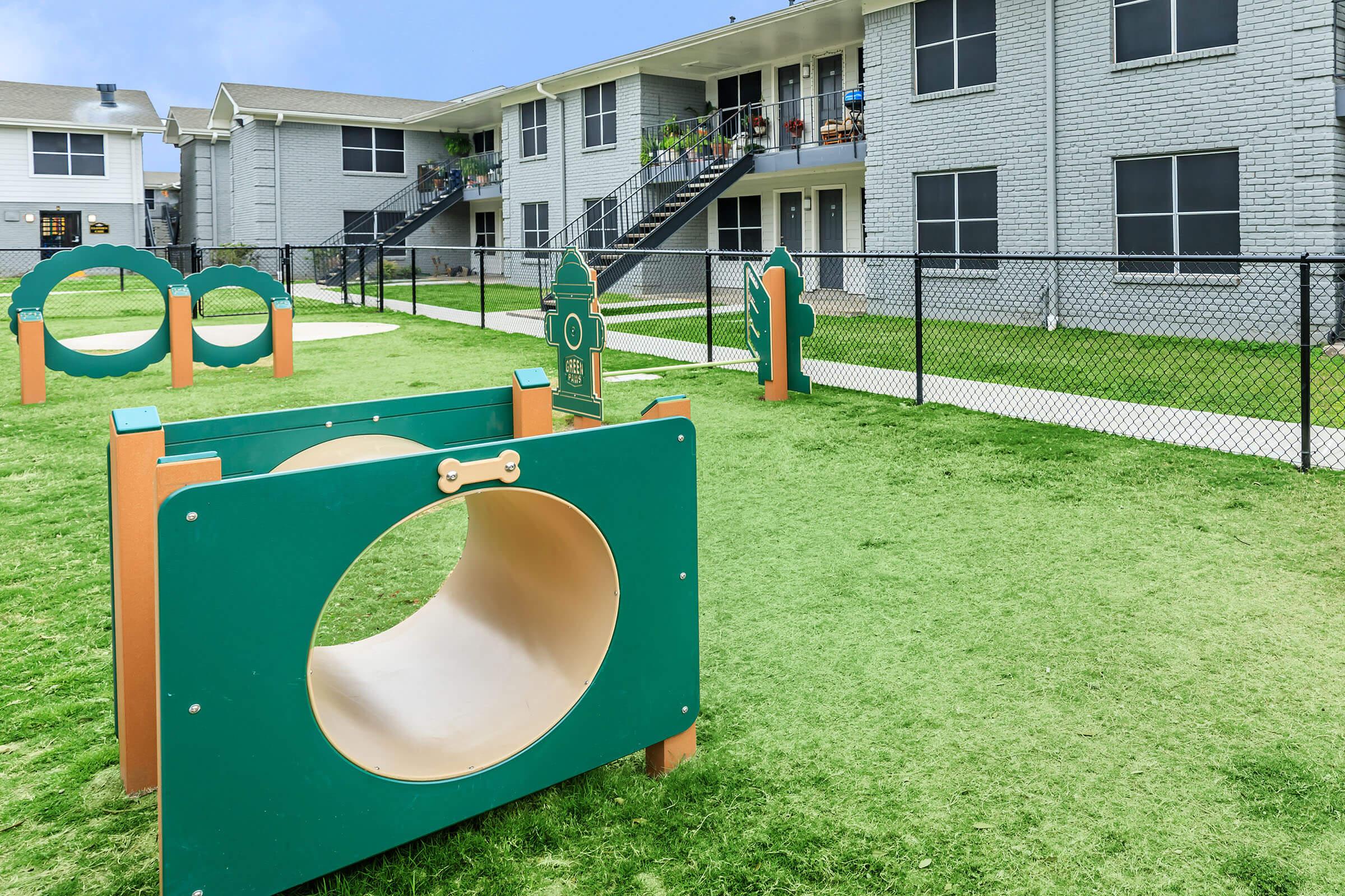 a green lawn in front of a building