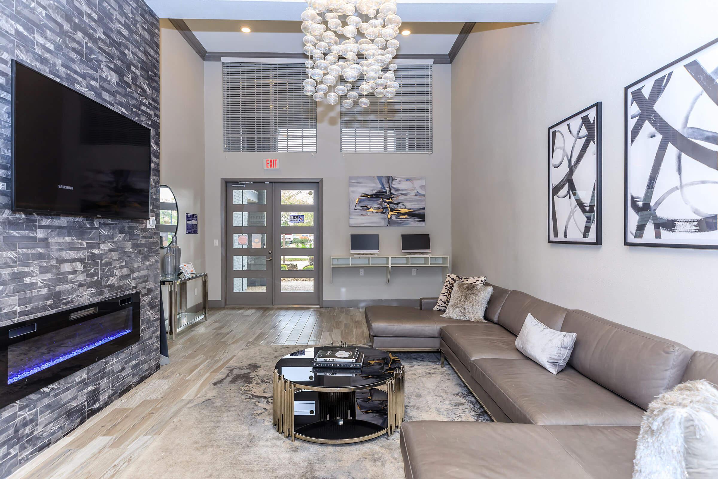 a living room filled with furniture and a fireplace