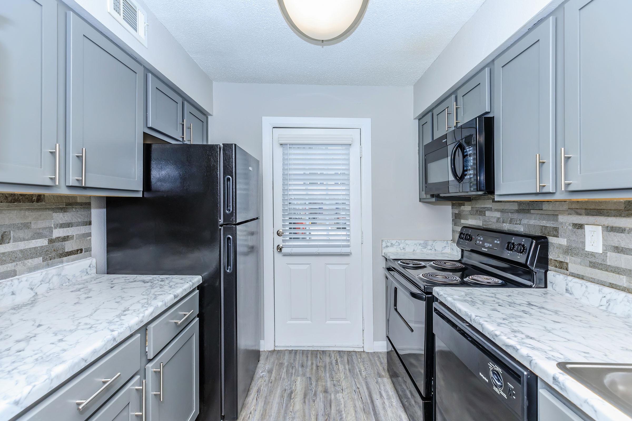 a modern kitchen with stainless steel appliances