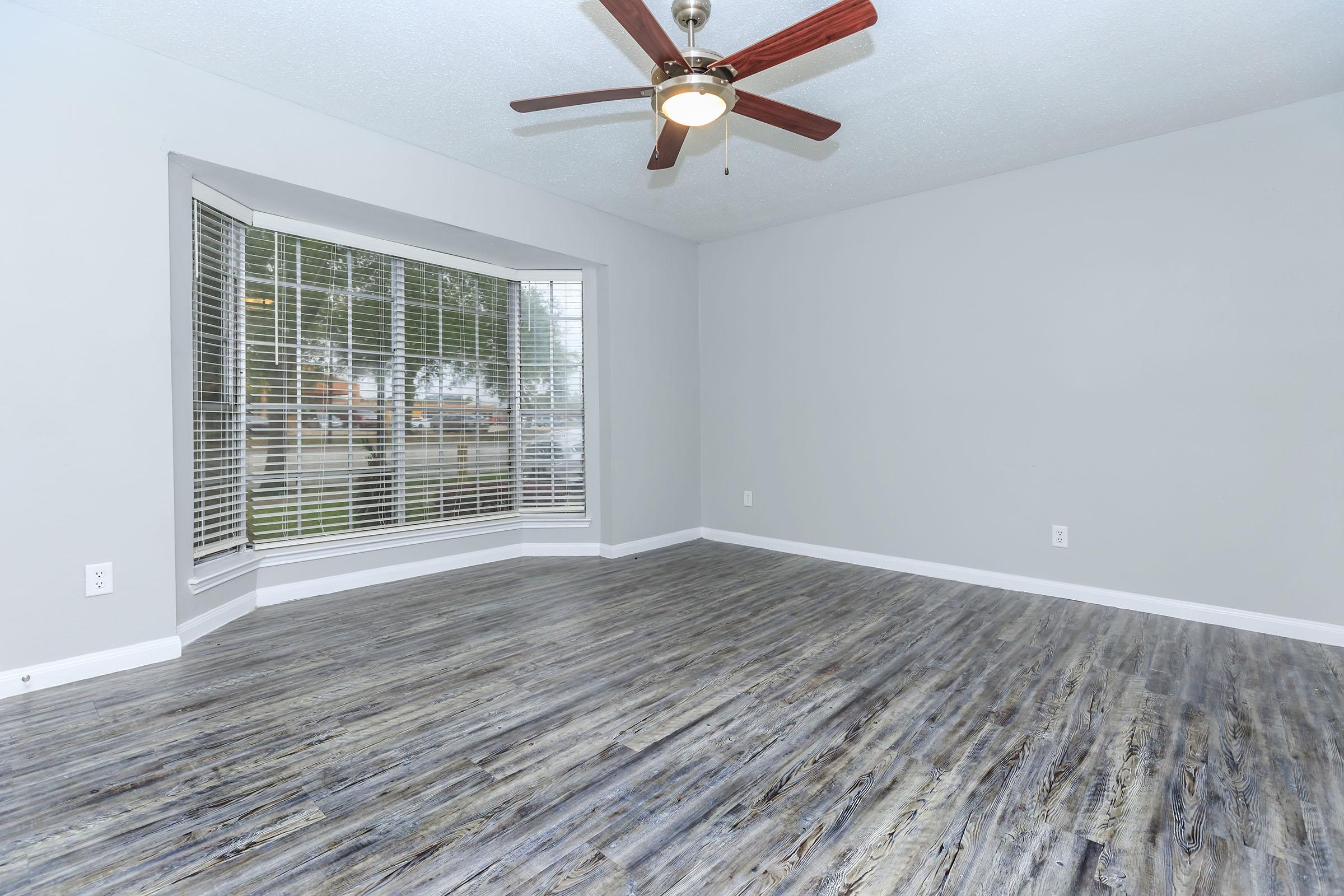 a bedroom with a large window