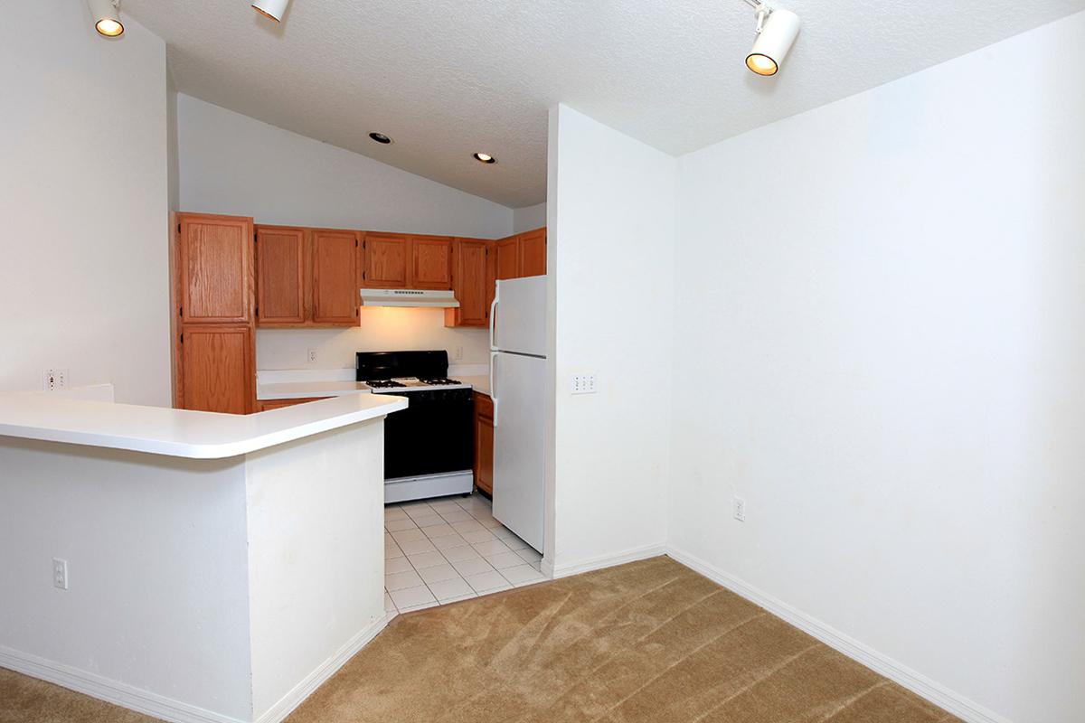 a large white refrigerator in a kitchen