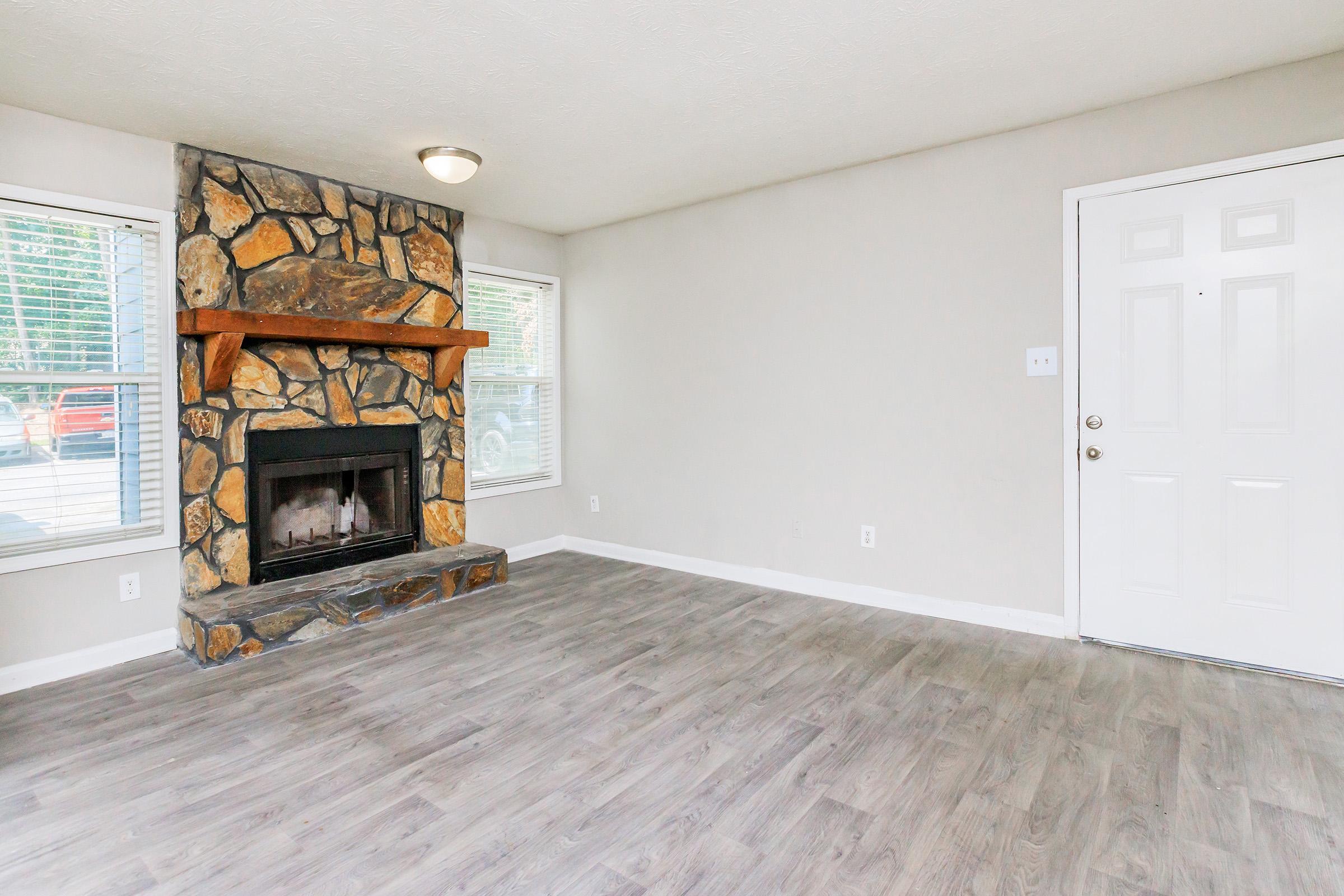 a living room with a fireplace