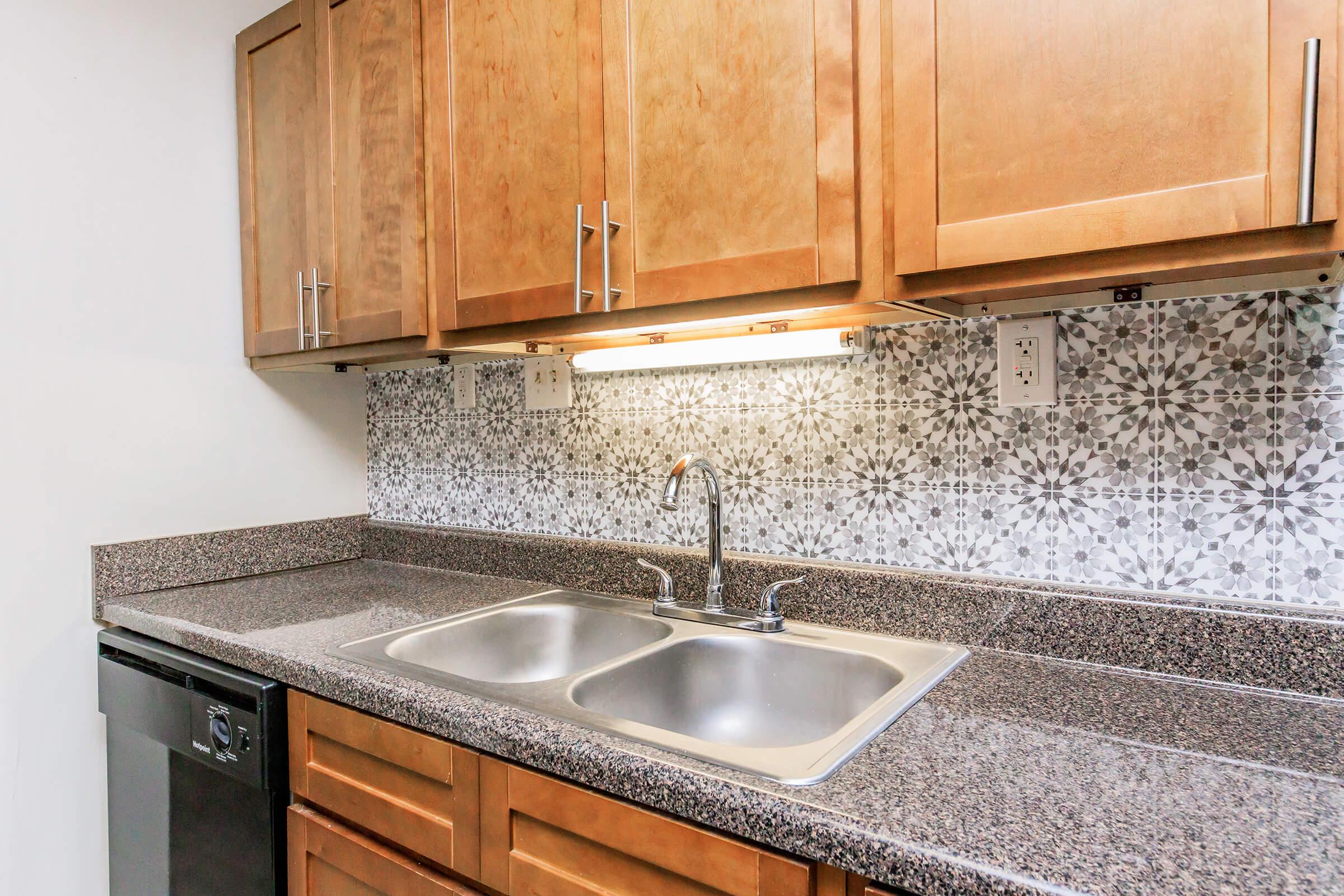 a kitchen with a sink and a microwave