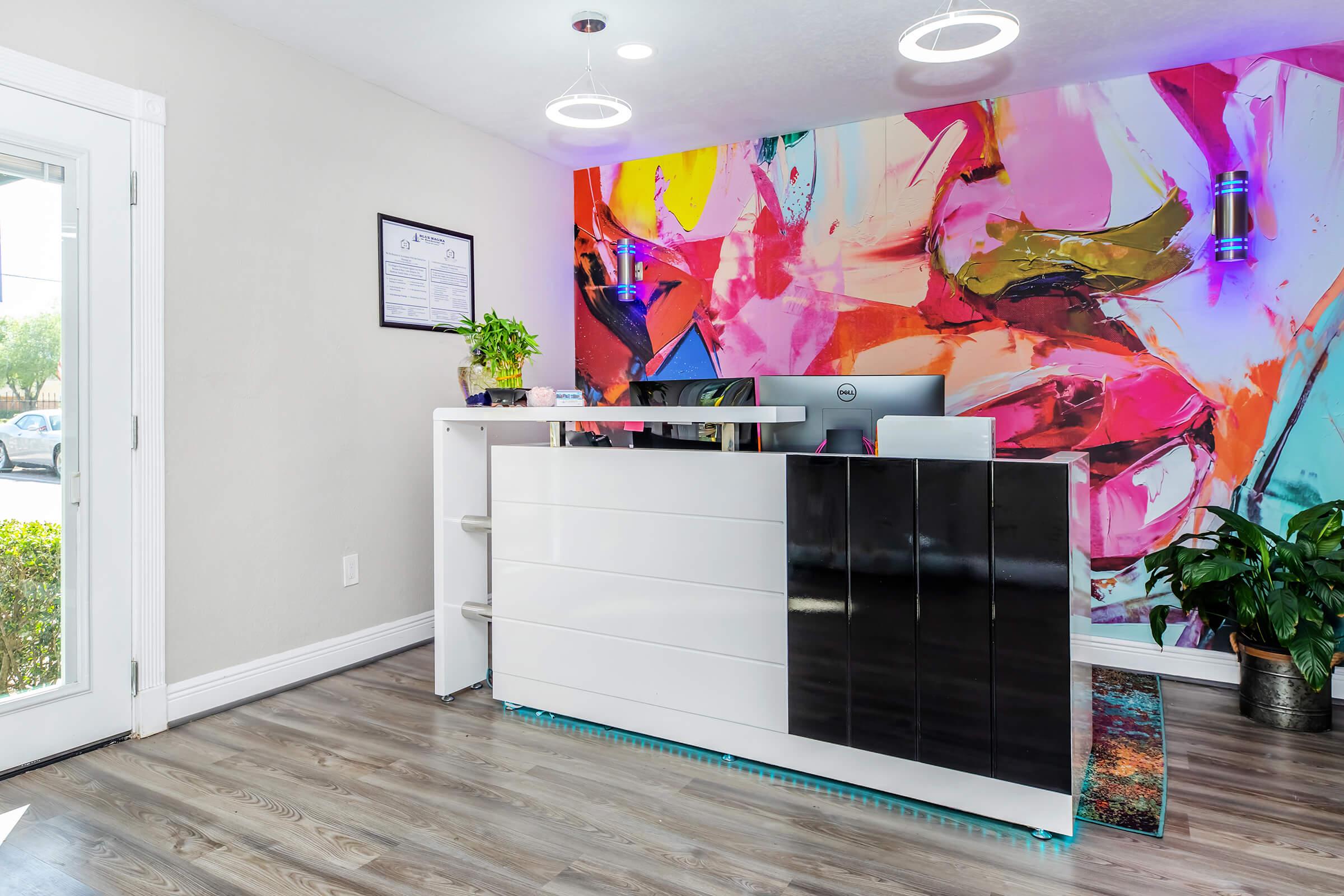 a living room filled with furniture and a flat screen tv