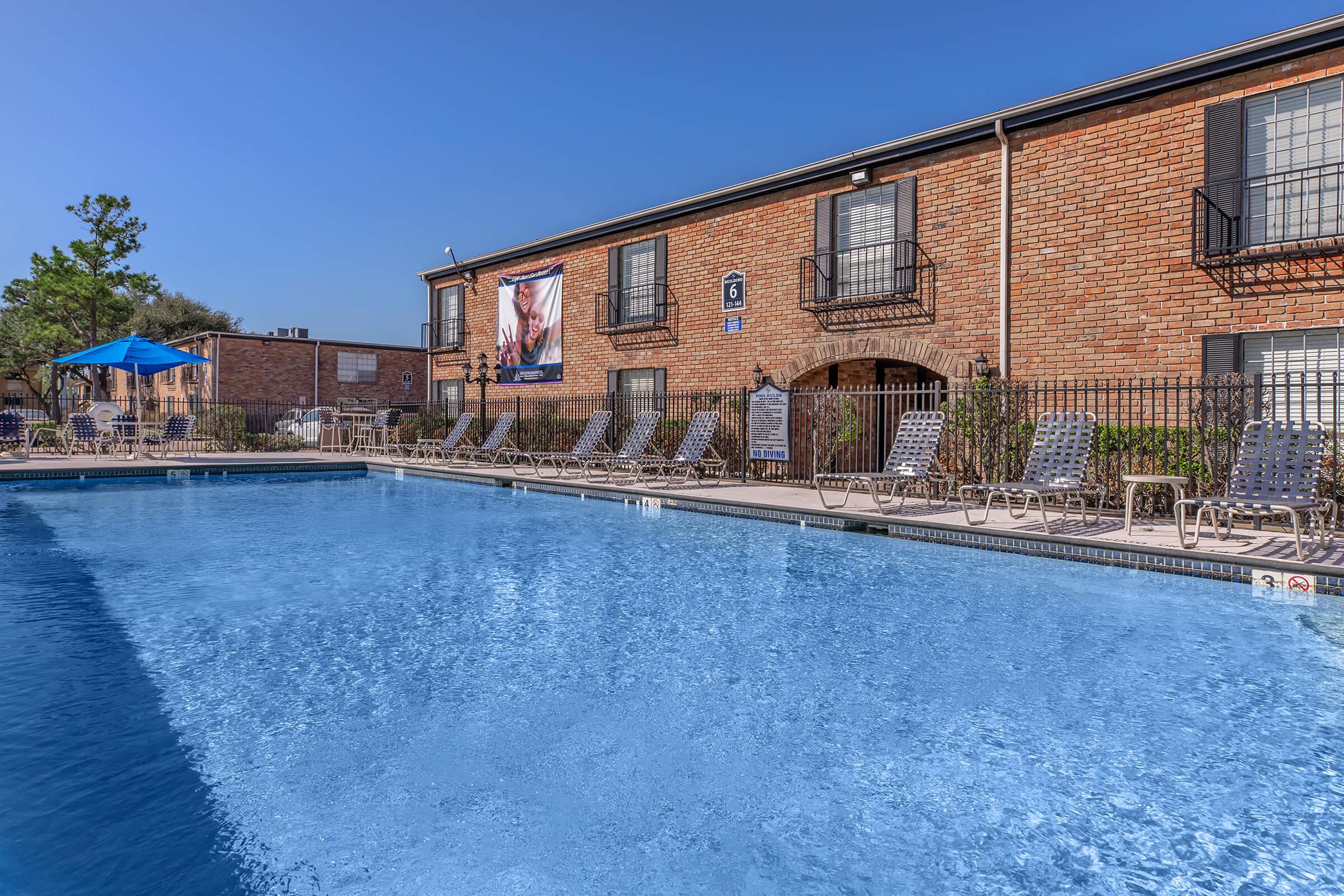 a large pool of water in front of a building